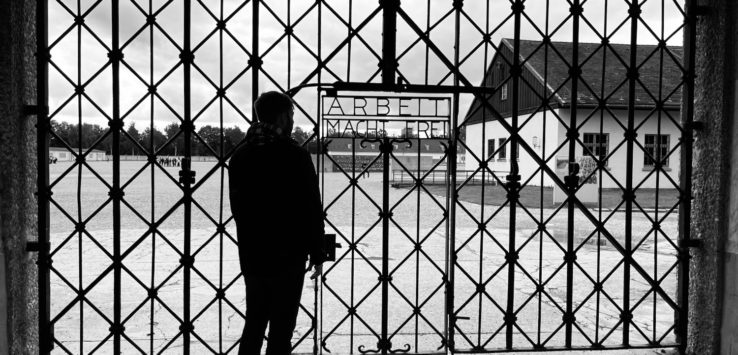 a man standing in front of a gate