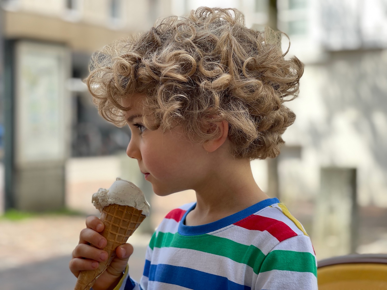 a child eating an ice cream cone