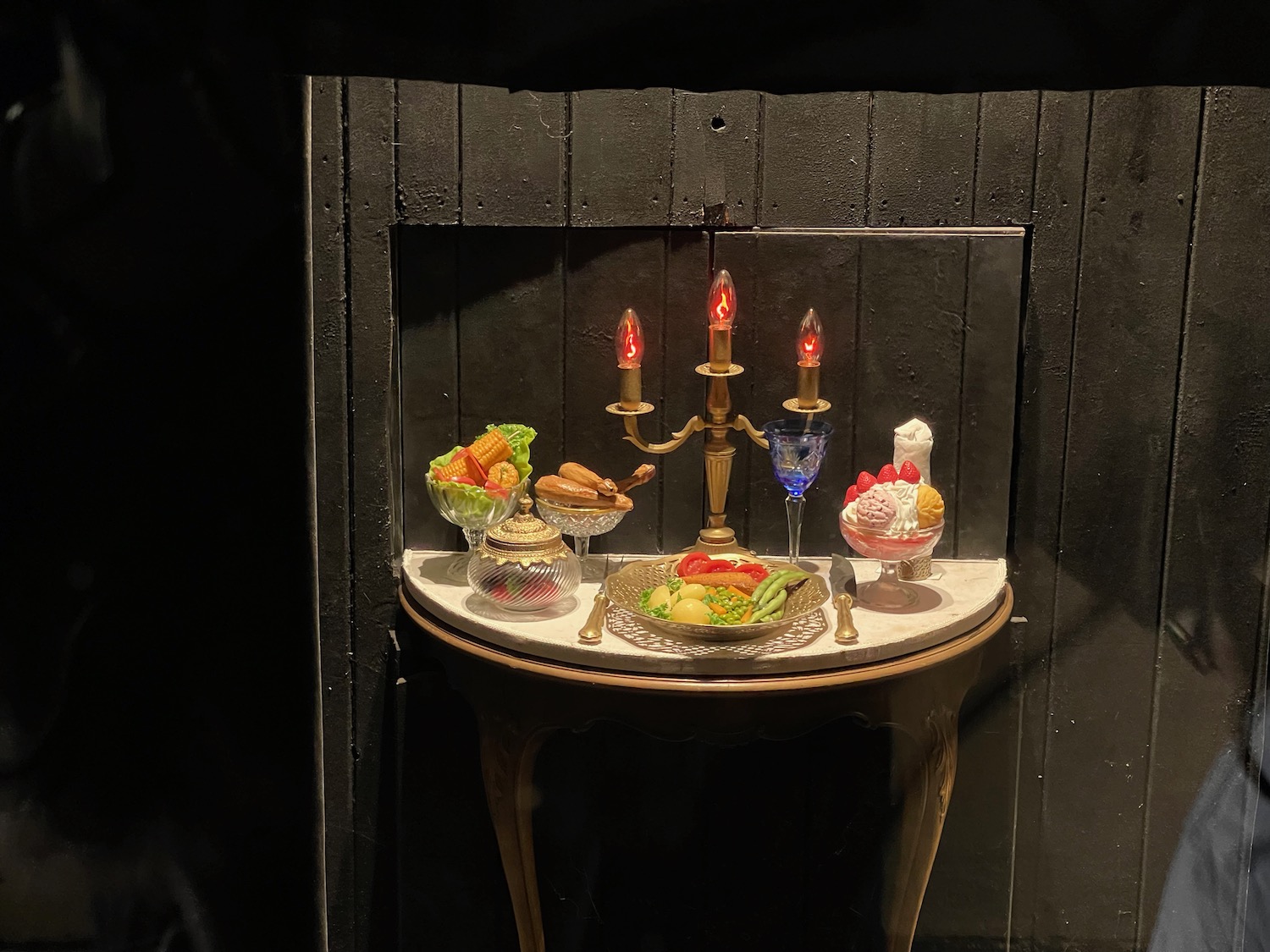 a table with food and candles on it