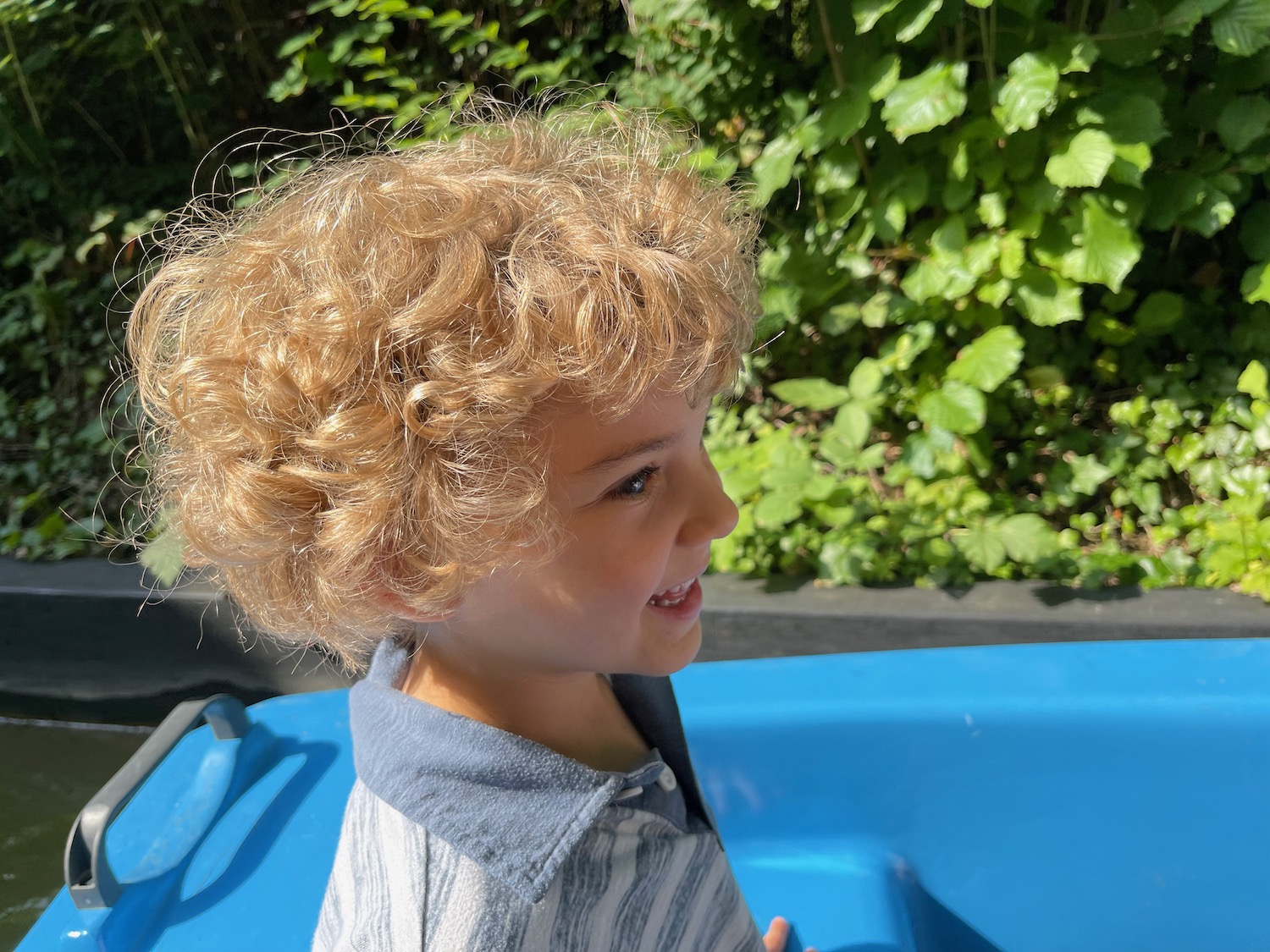 a child with curly blonde hair