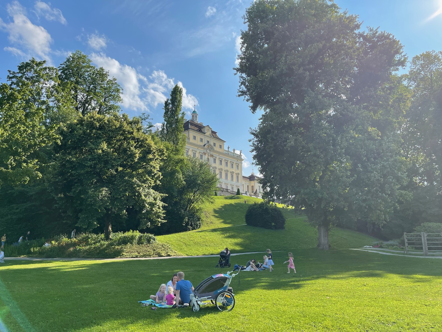 a group of kids sitting in a park