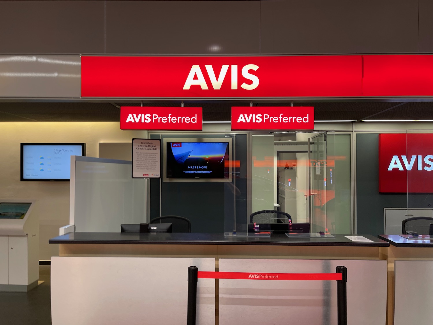 a red sign above a counter