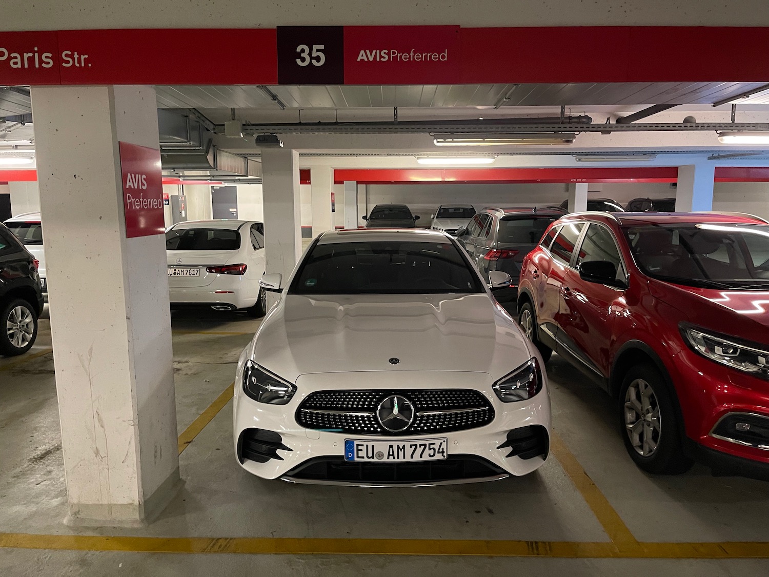 a white car parked in a parking garage