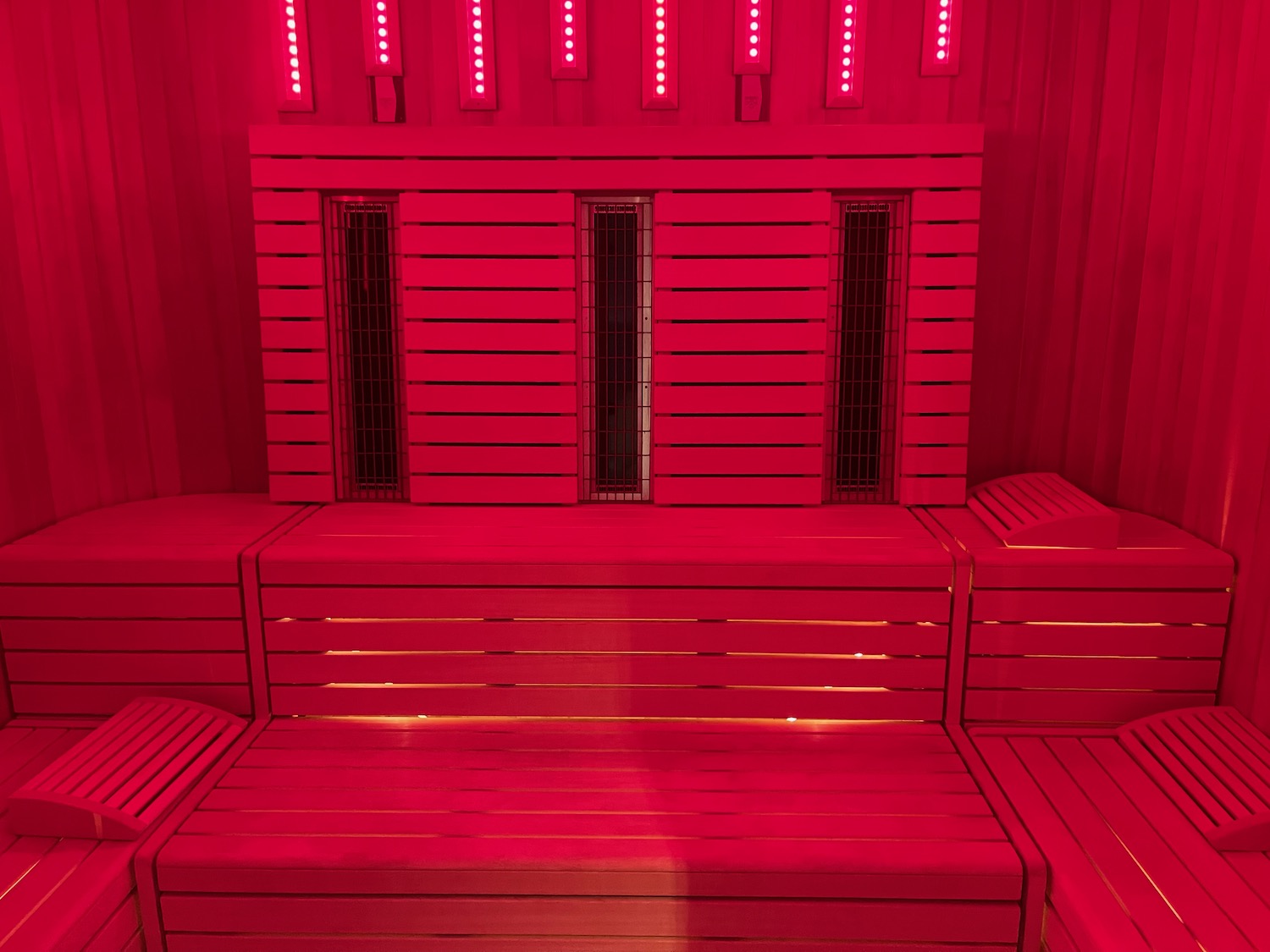 a red wooden bench in a room