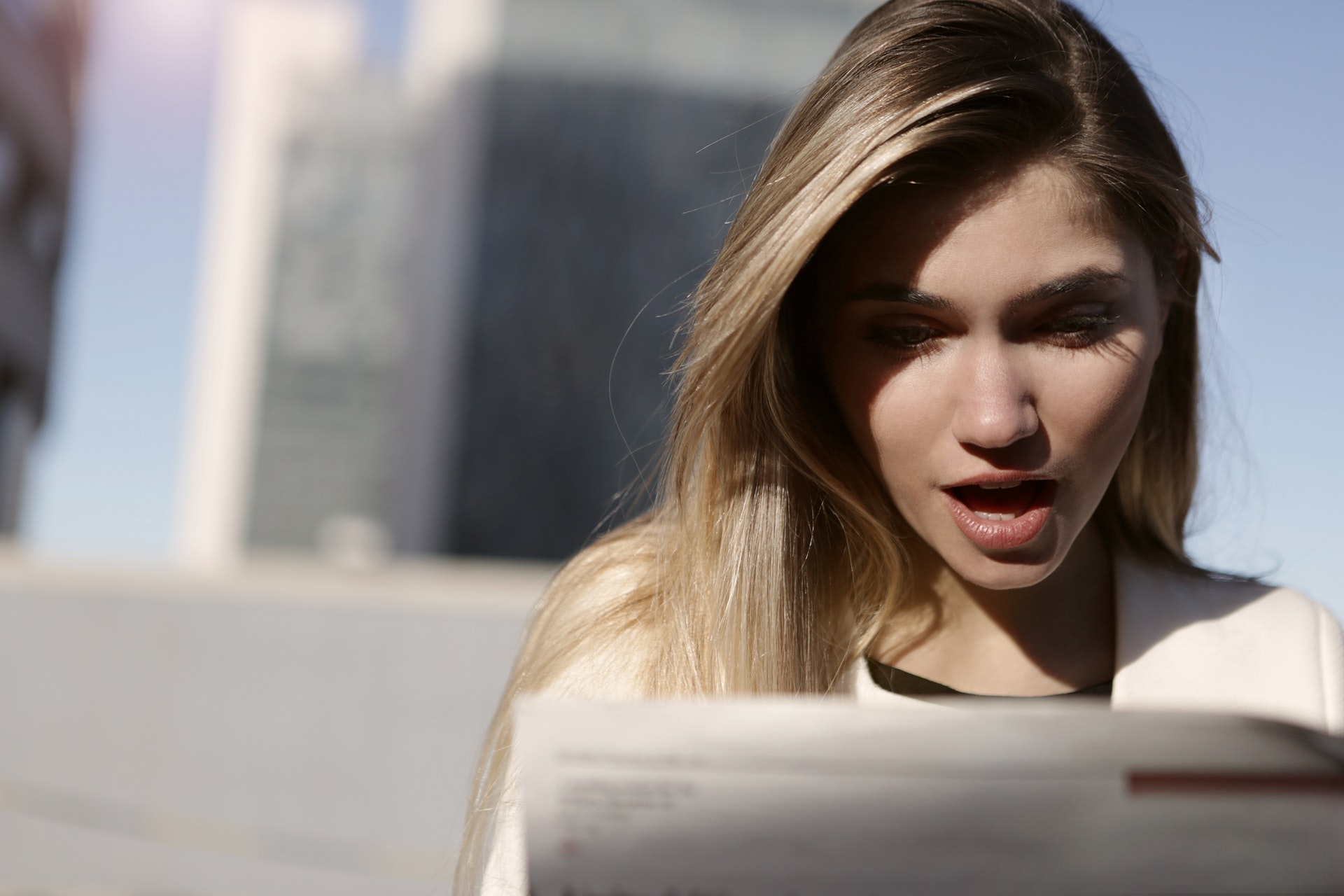 a woman looking at a piece of paper