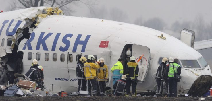 a group of people around an airplane