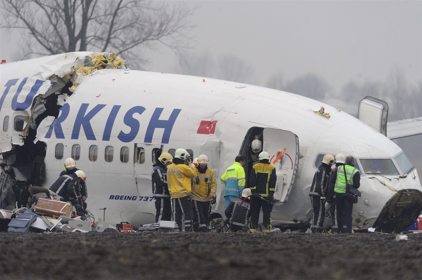 a group of people around an airplane