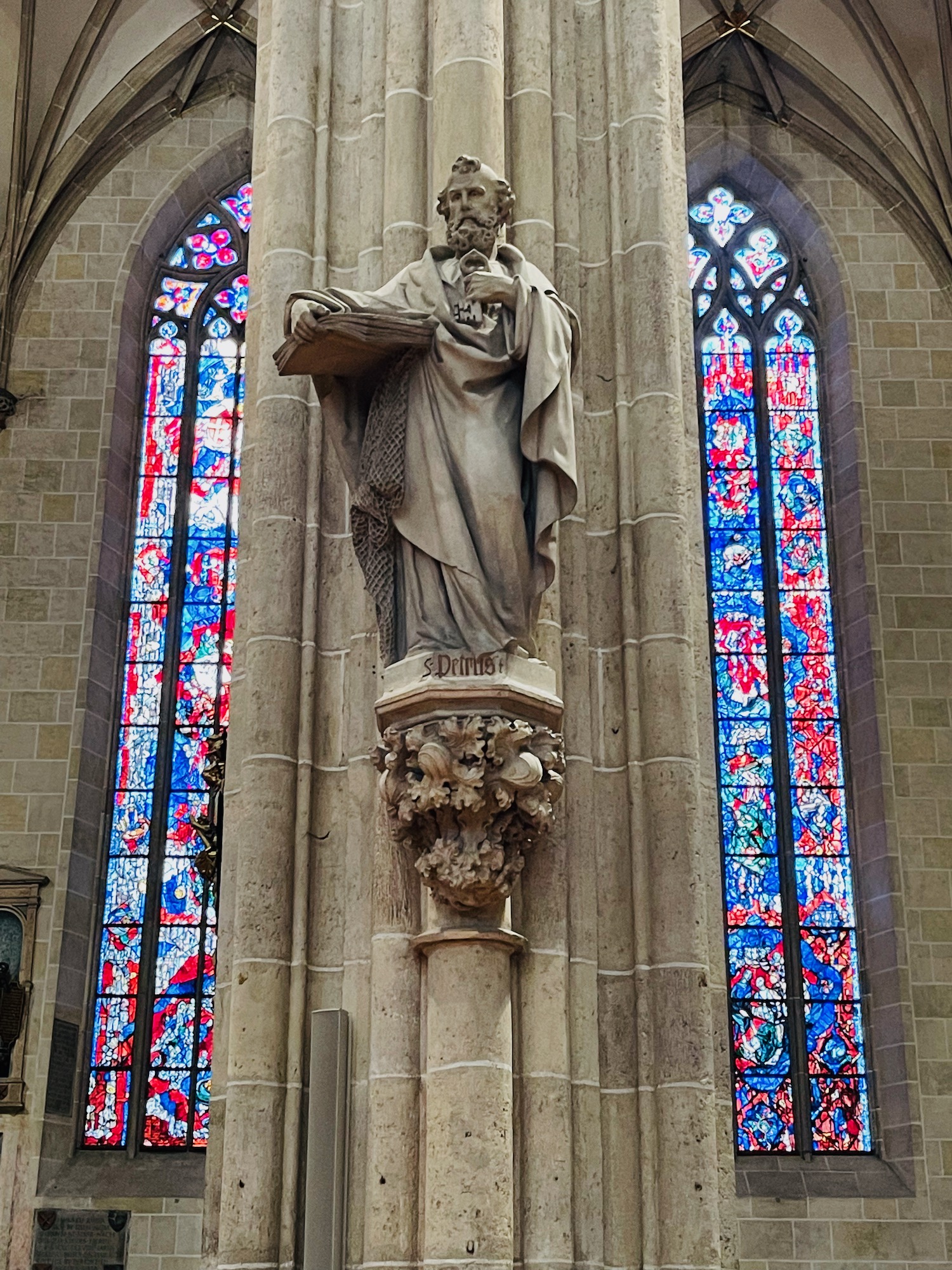 a statue of a man in a church