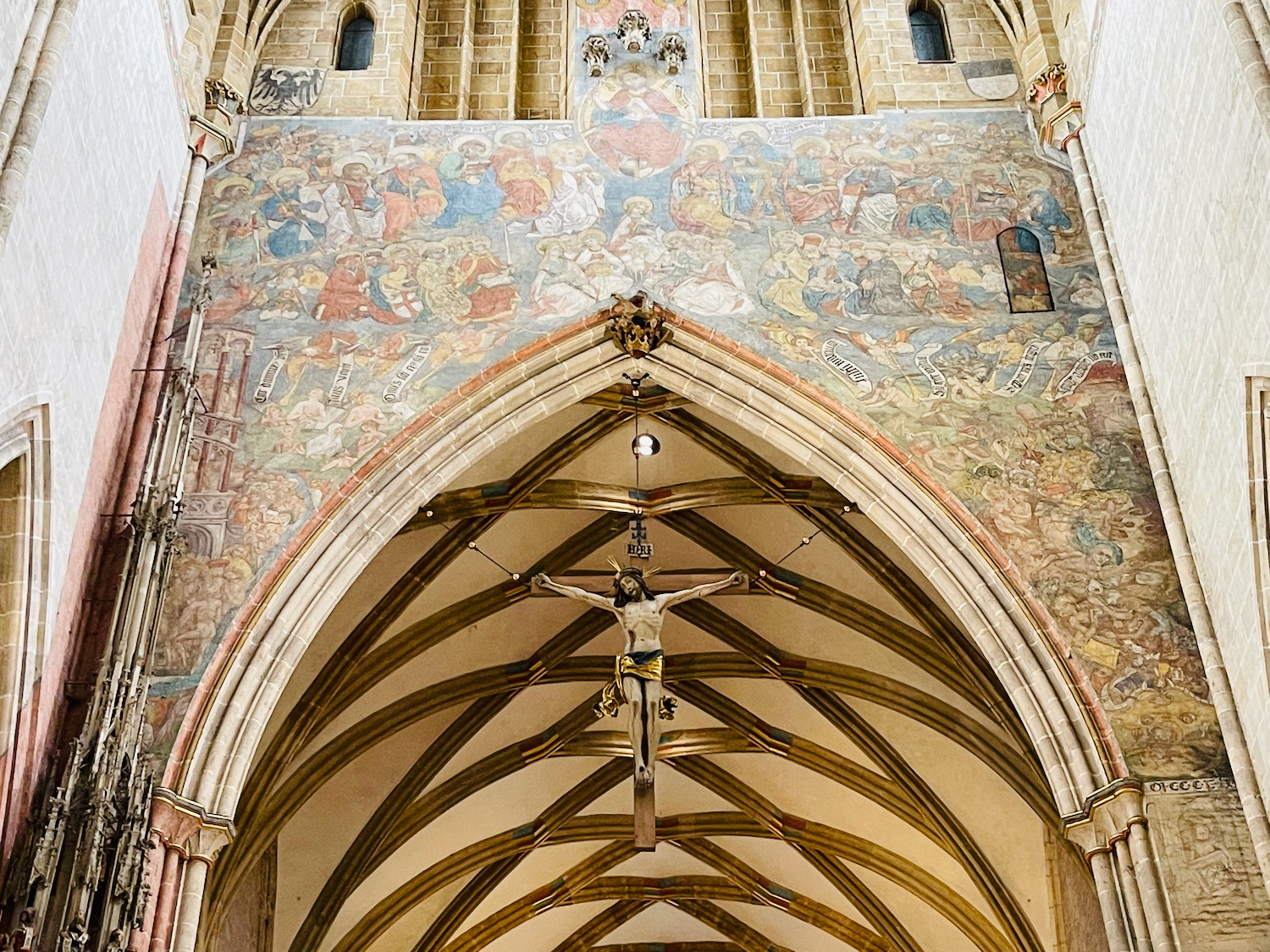 a cross from the ceiling of a church