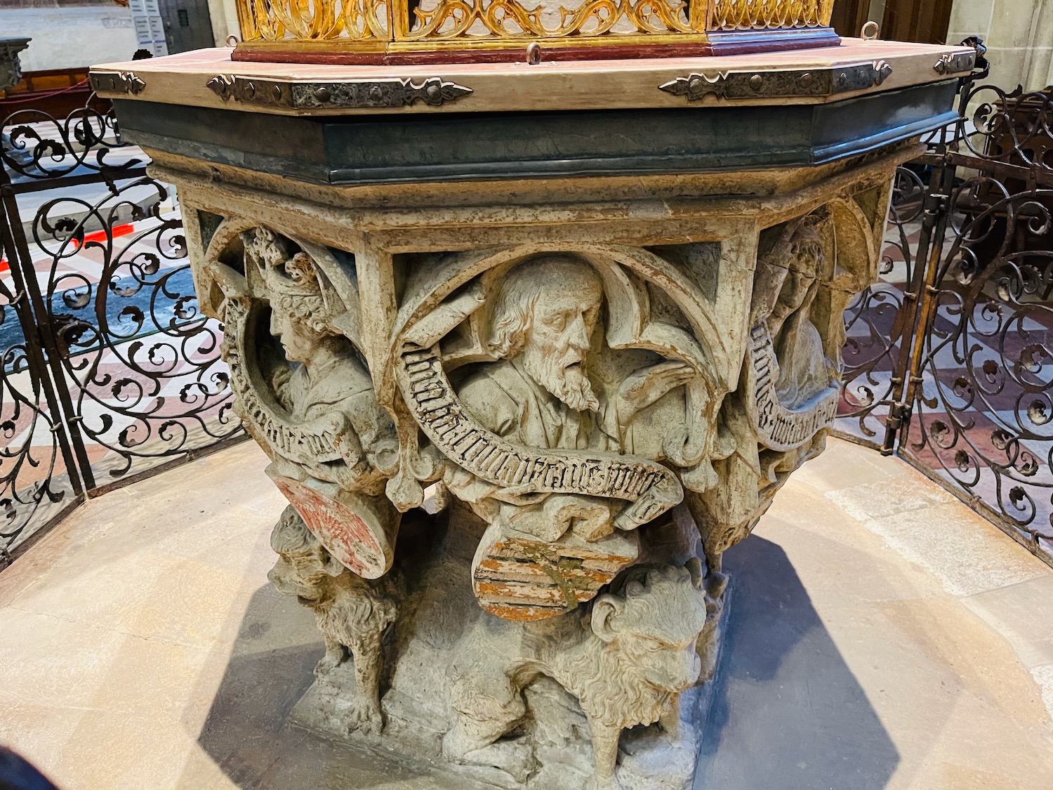 a stone pedestal with carvings on it