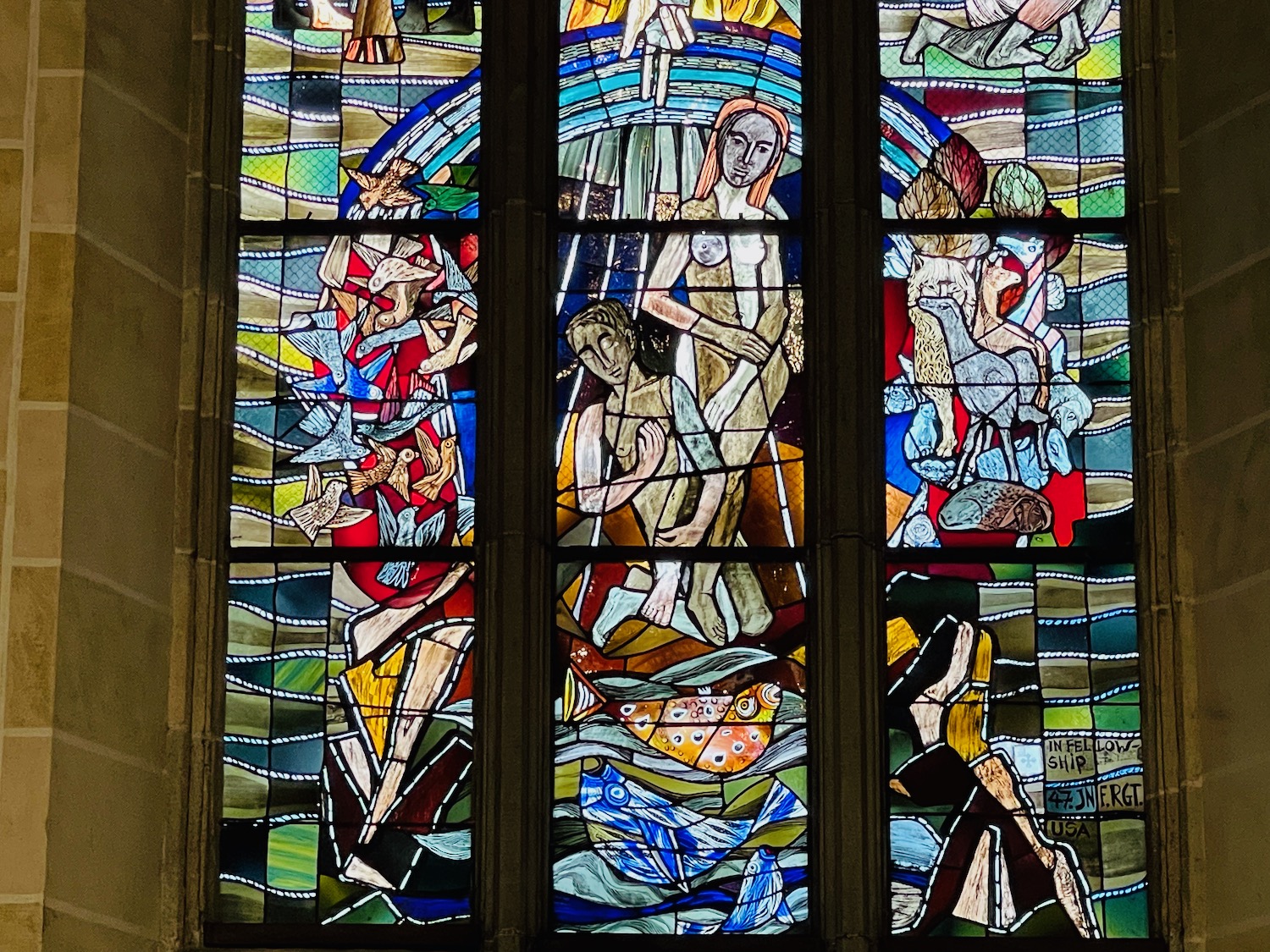 a stained glass window with many different colored glass