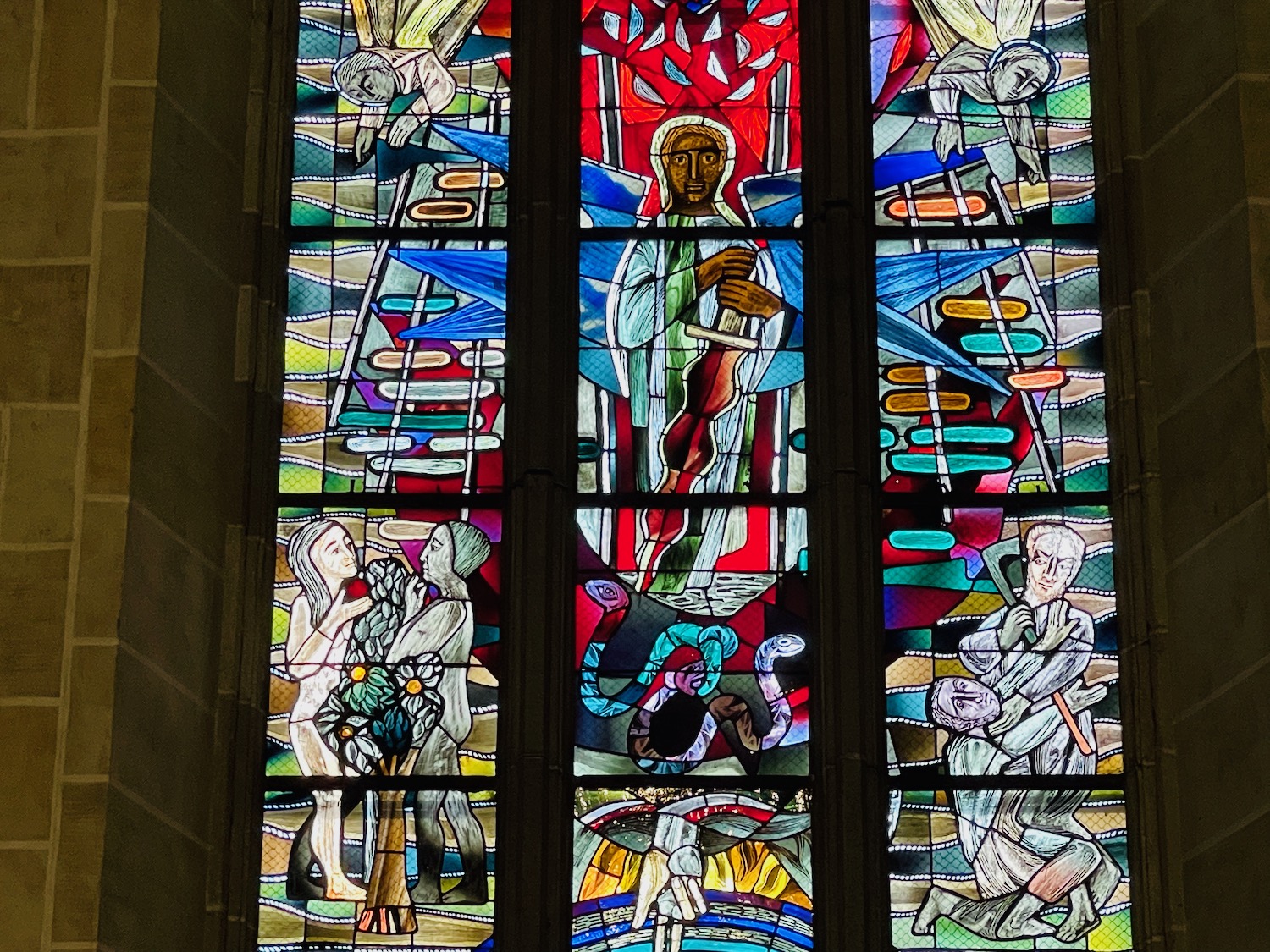 a stained glass window with a religious image