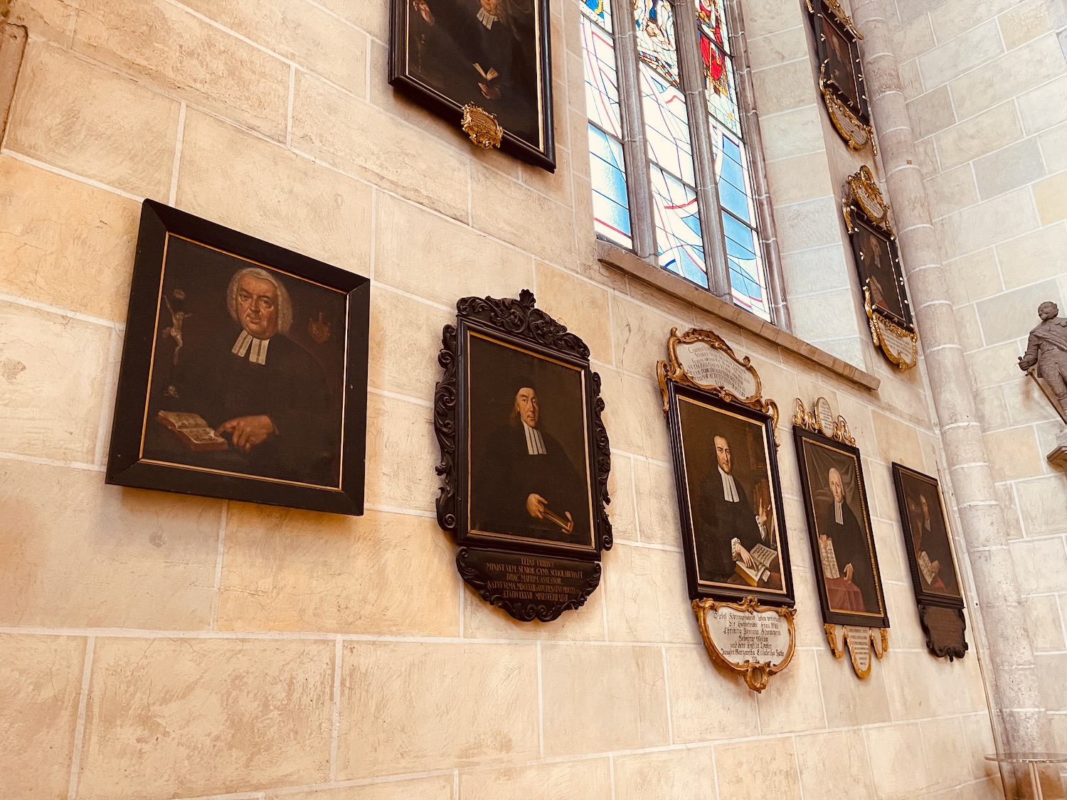 a group of framed pictures on a wall