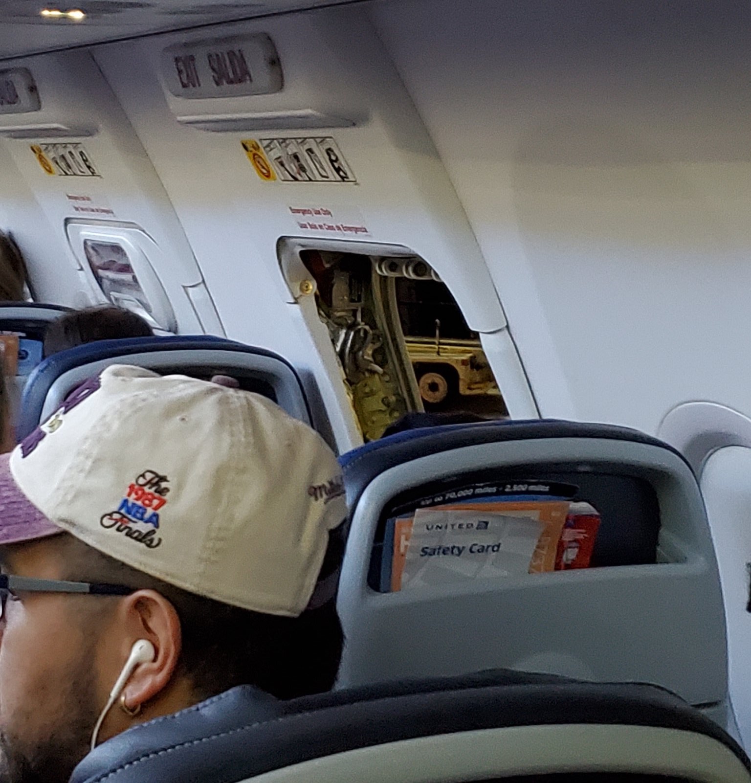 a man sitting in an airplane