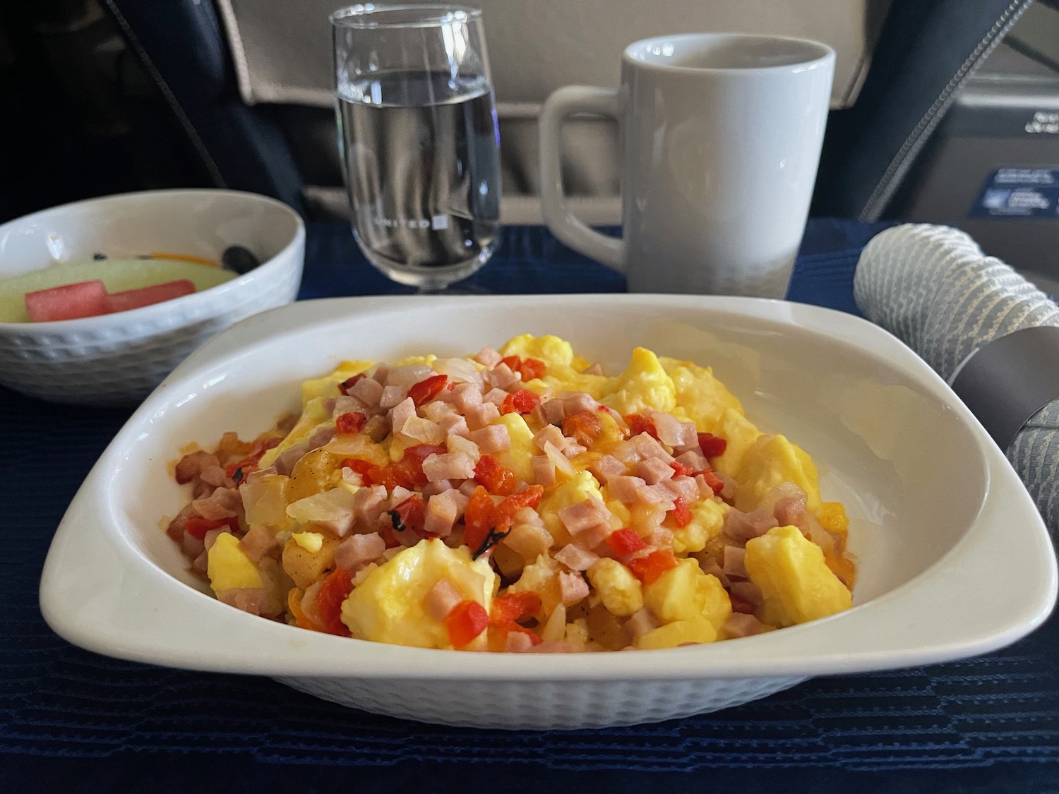 a bowl of food and a glass of water