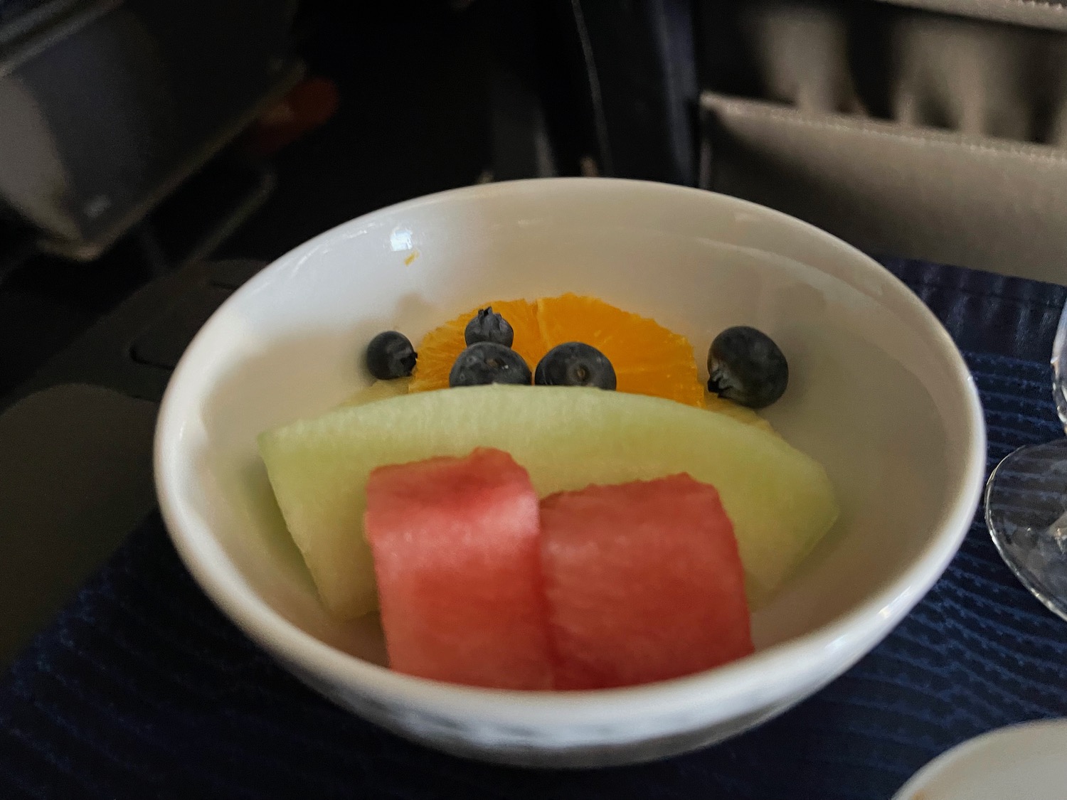 a bowl of fruit on a table