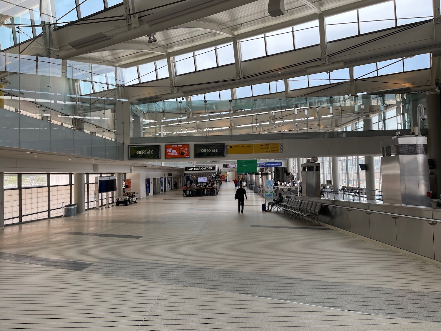 a person walking in a large airport terminal