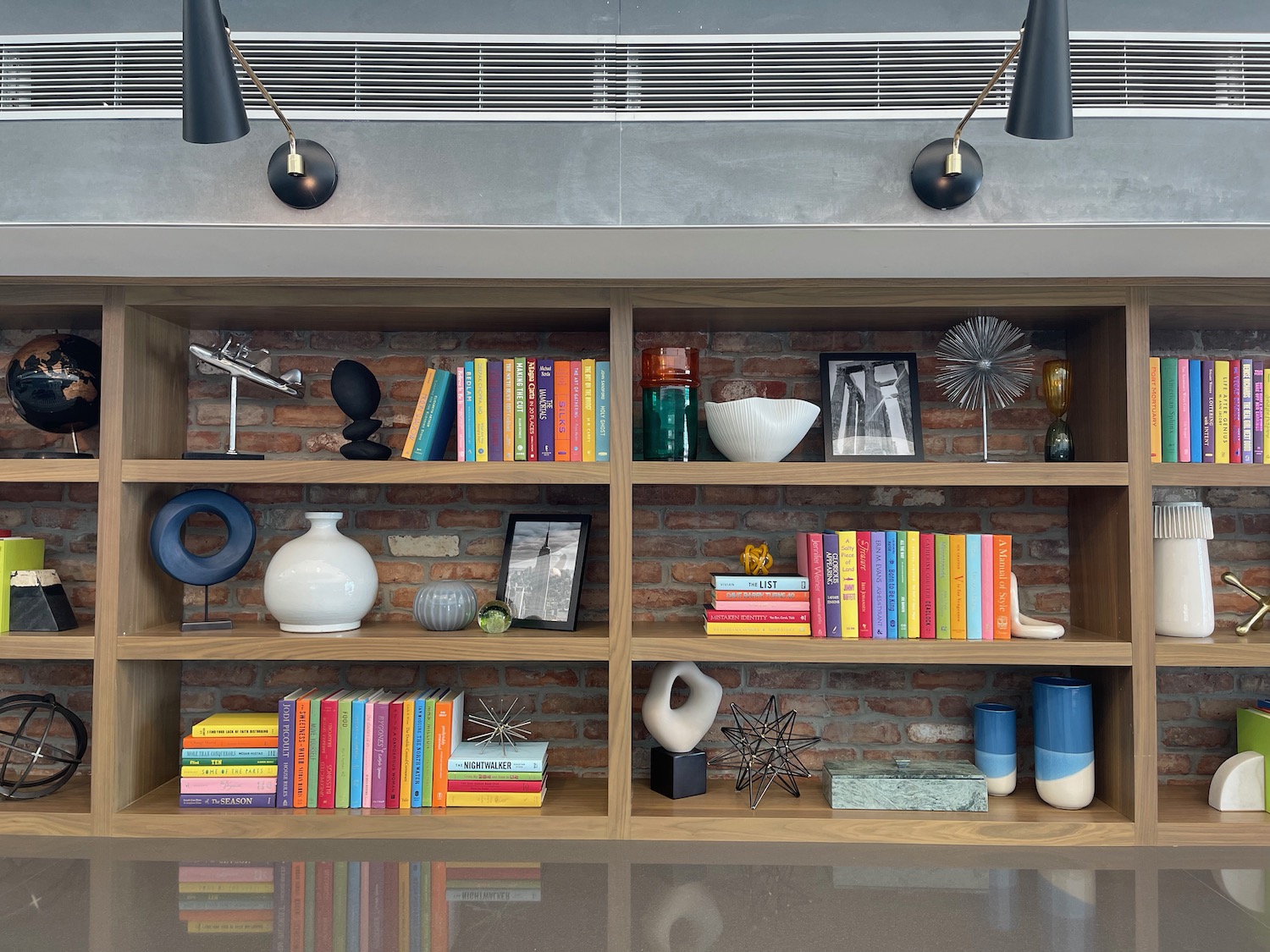 a shelf with books and objects on it