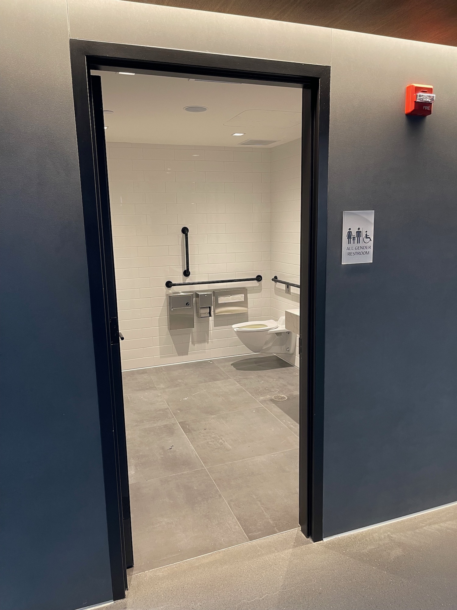 a bathroom with a door open