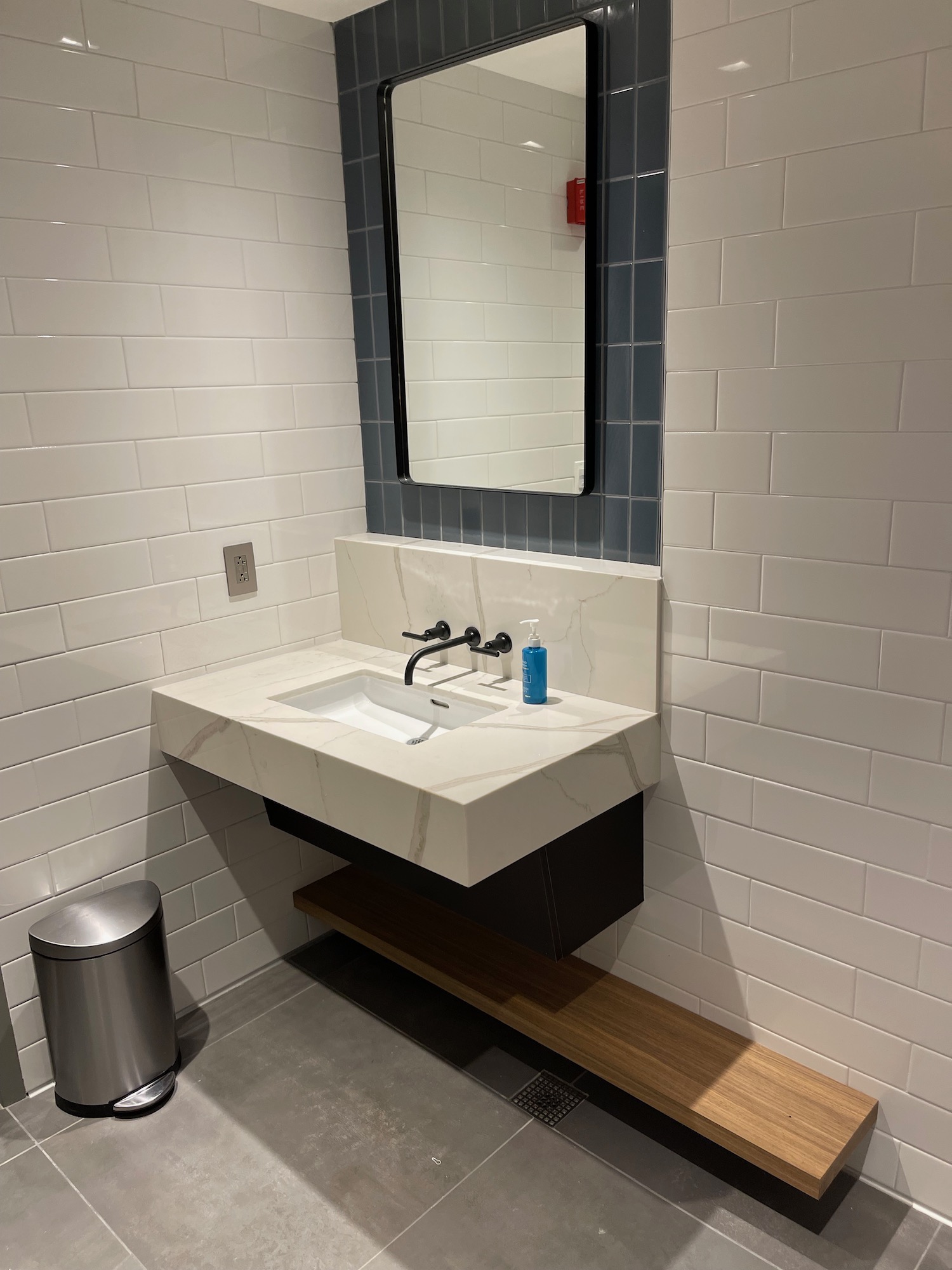 a bathroom sink with a mirror and a mirror