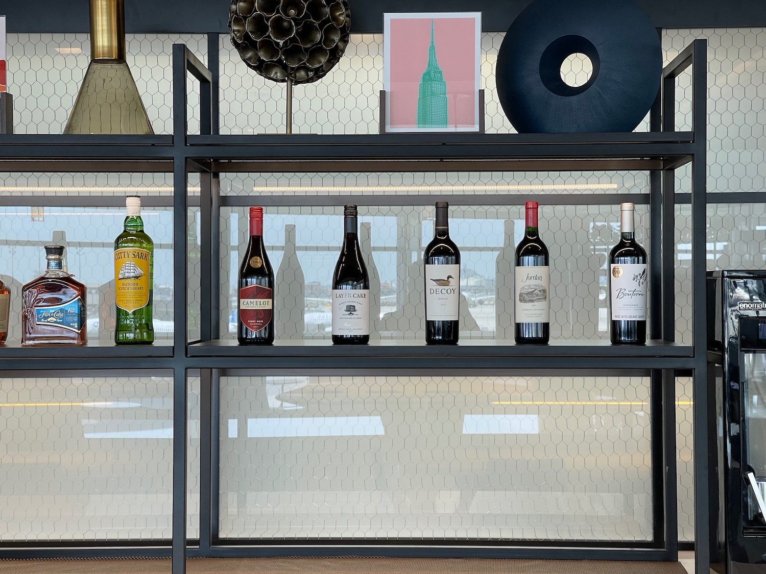 a shelf with bottles of wine