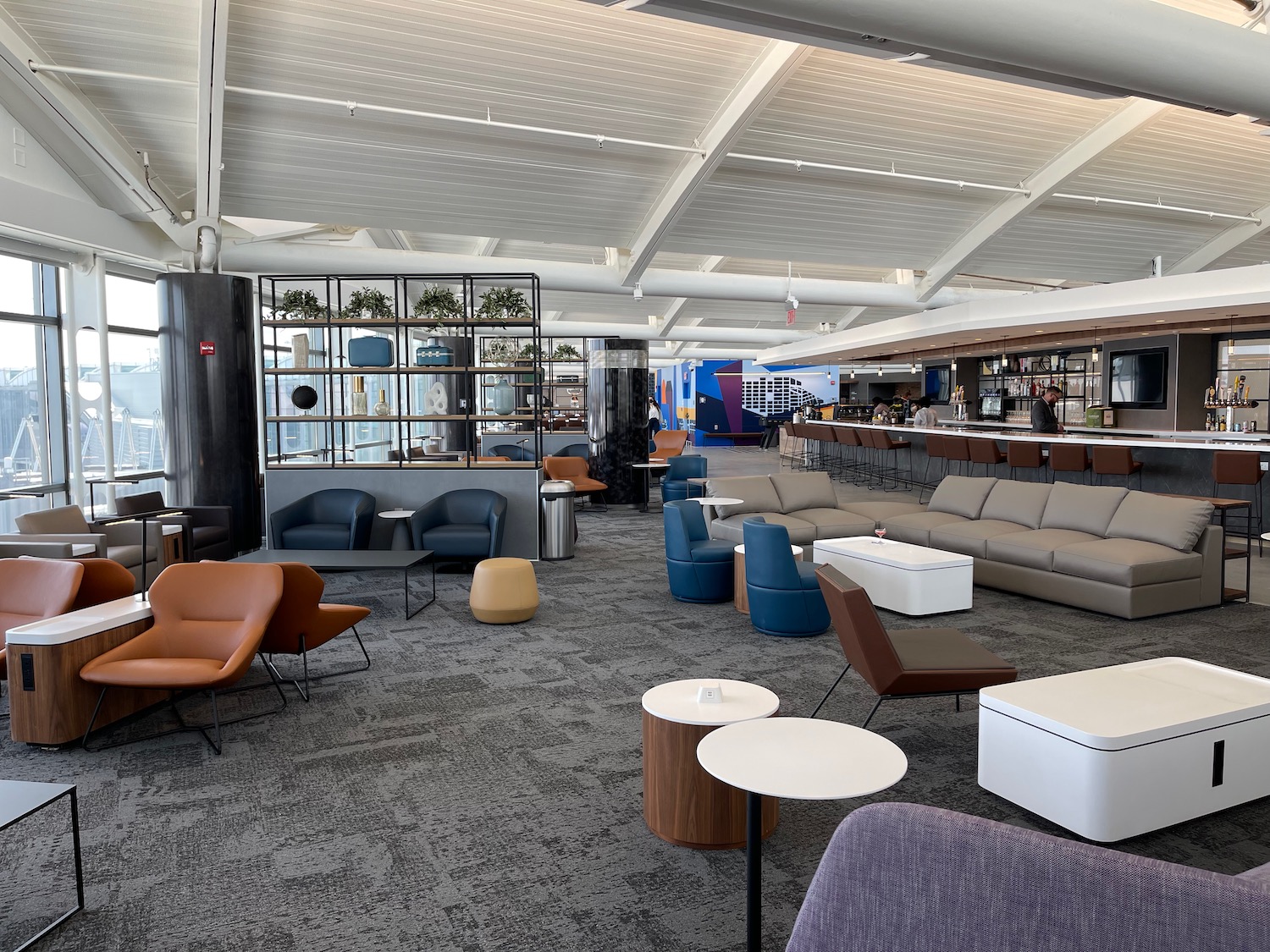 a lounge area with chairs and tables