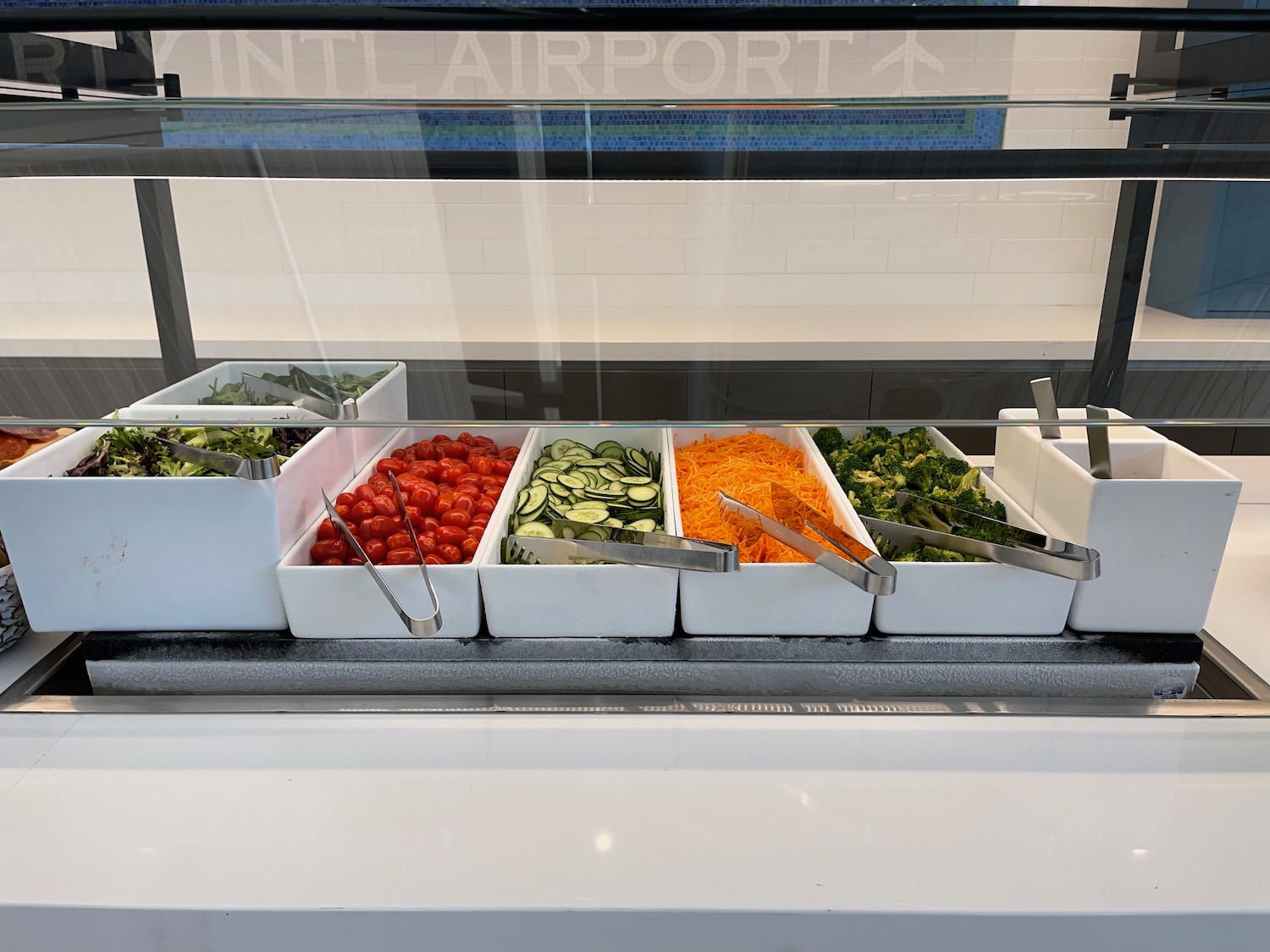 a salad bar with different vegetables