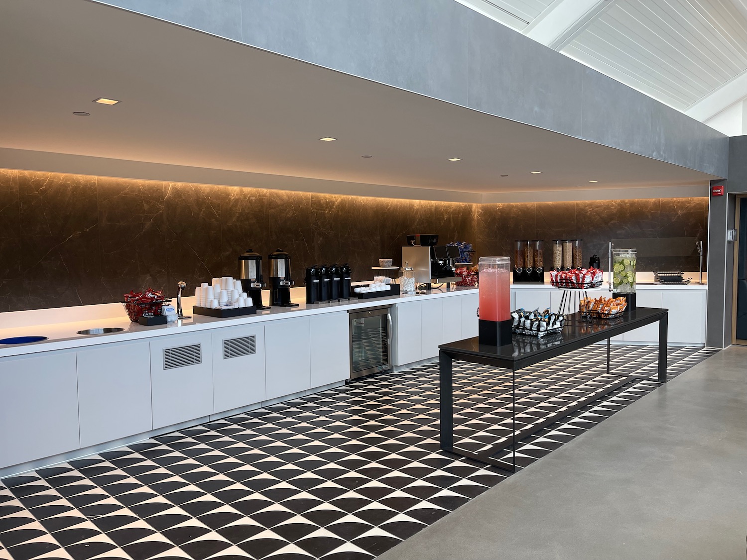 a room with a black and white checkered floor and a black and white counter