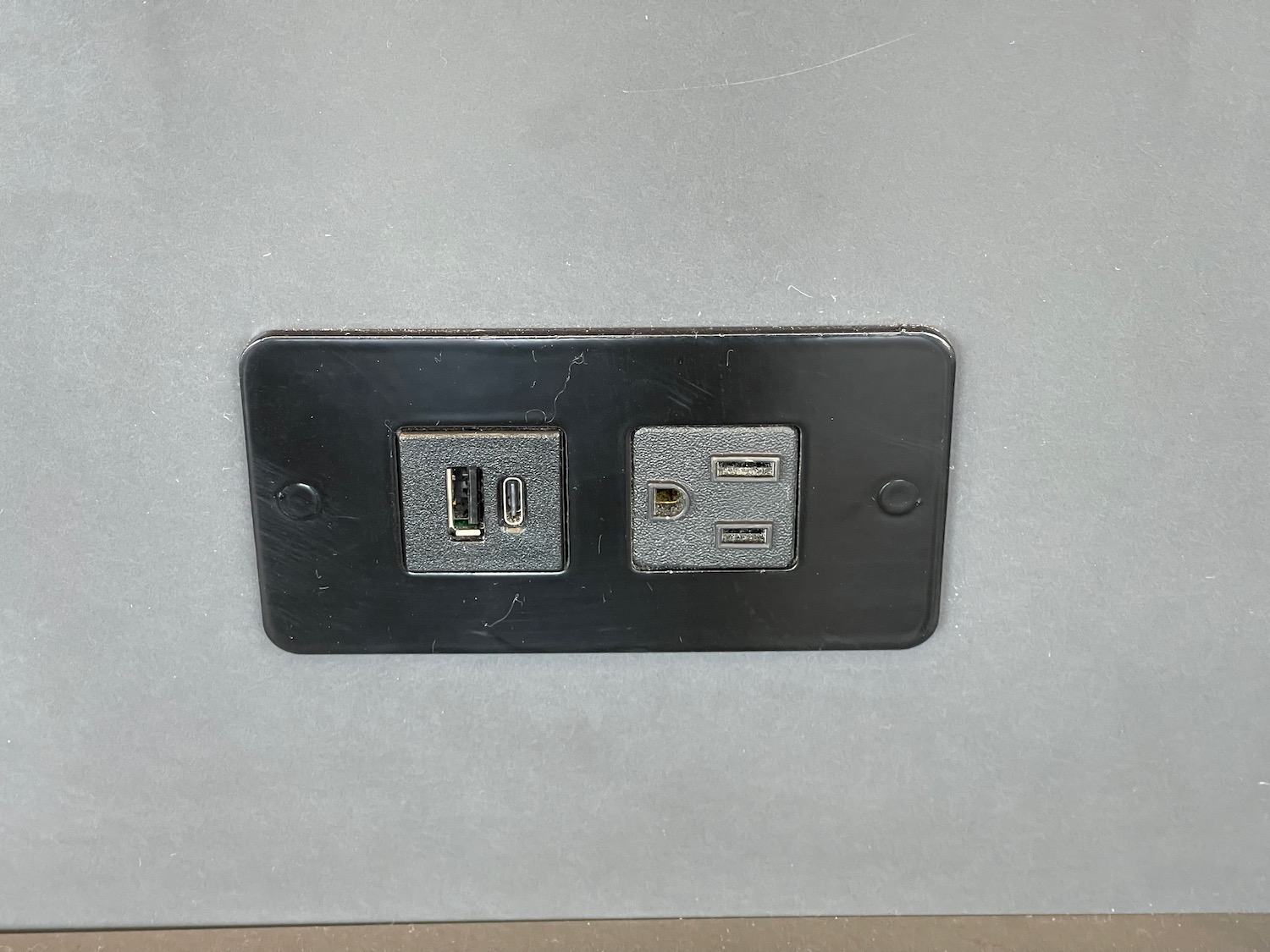 a black wall outlet with usb ports