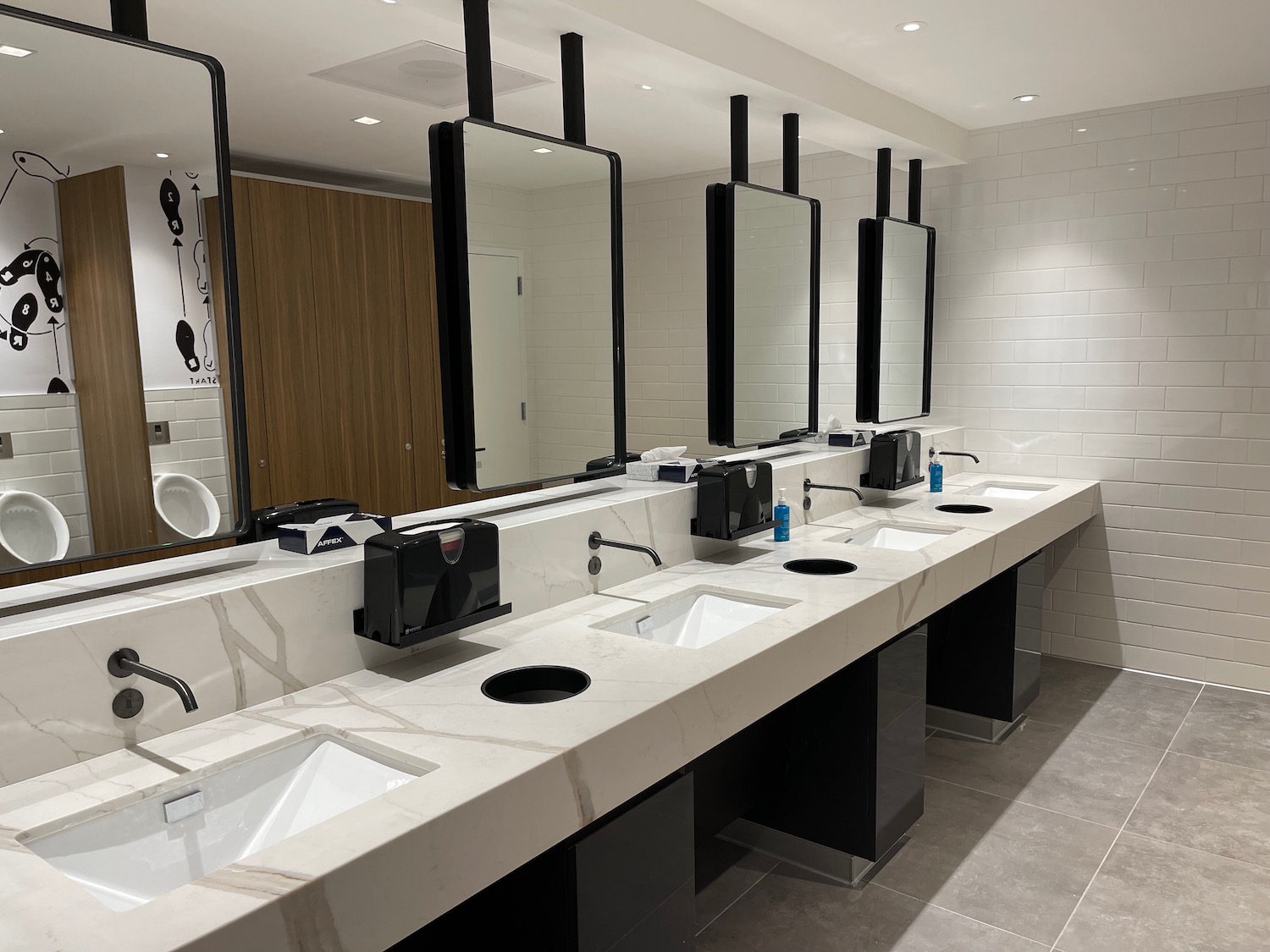 a bathroom with sinks and mirrors