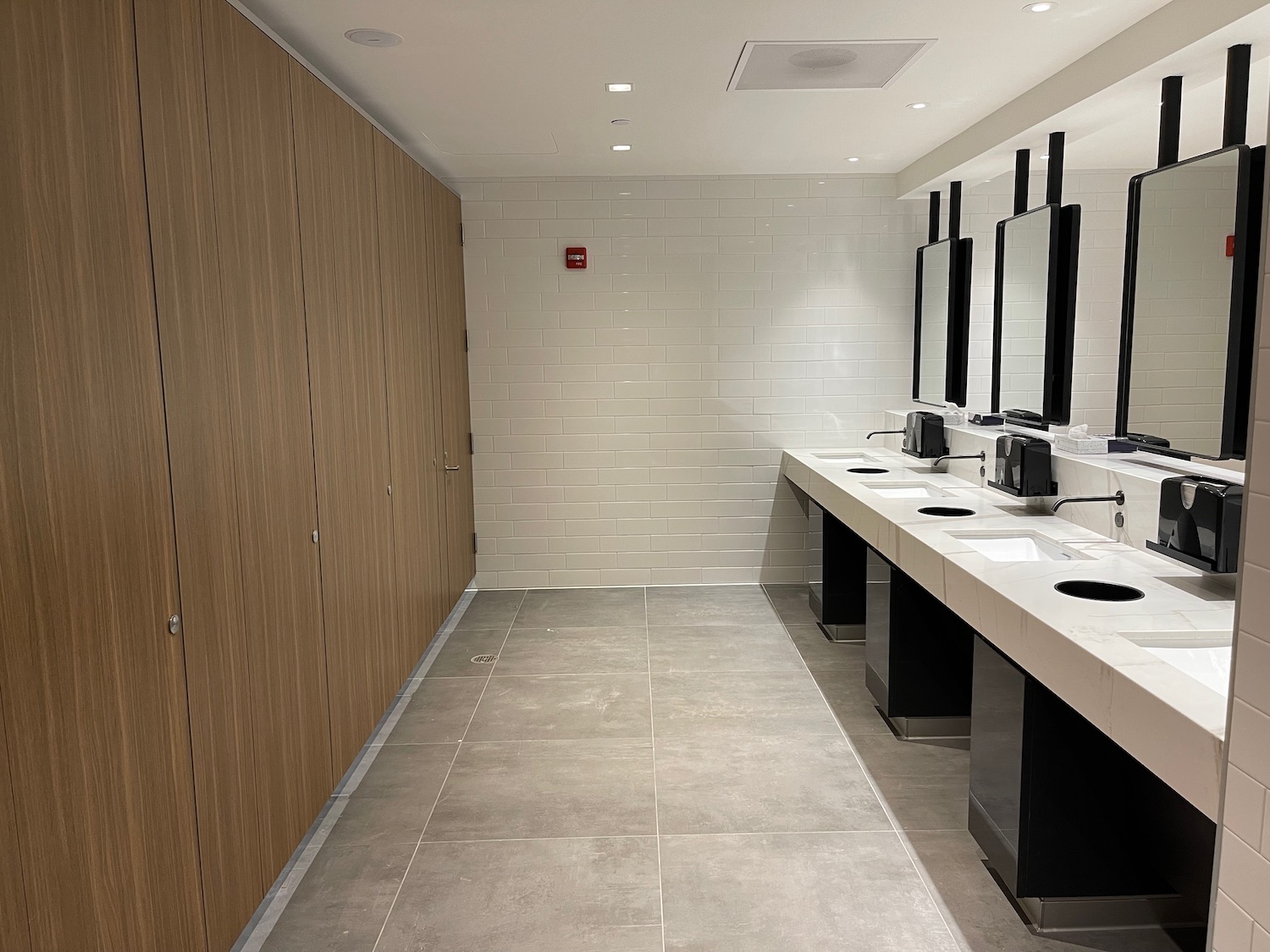 a bathroom with sinks and mirrors