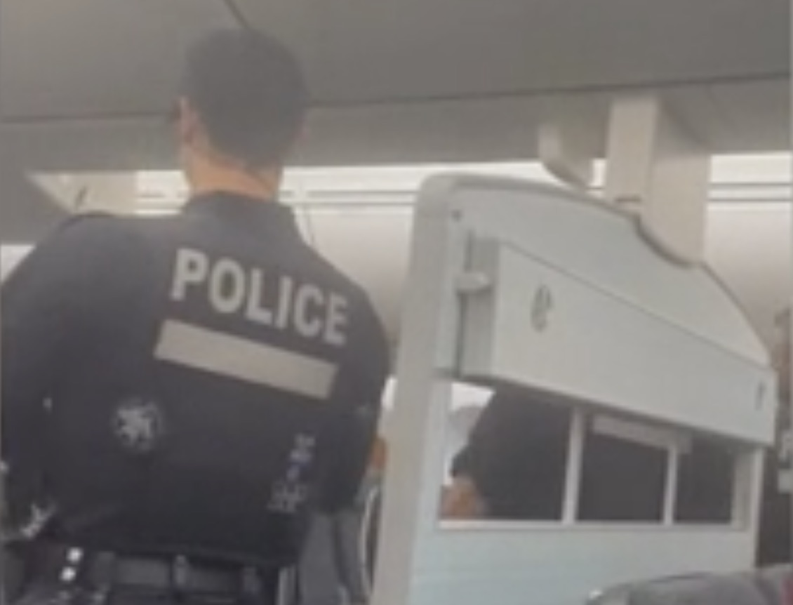 a police officer standing in a bus