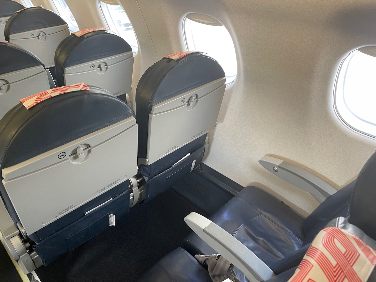 seats in an airplane with windows