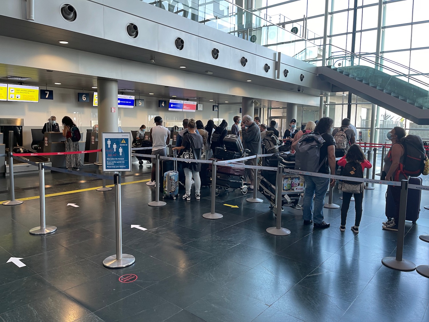 a group of people standing in a line in a building