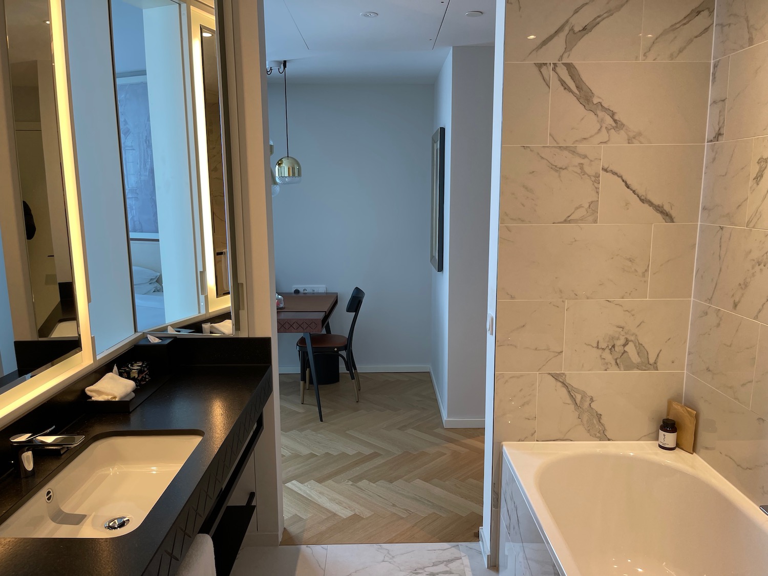 a bathroom with marble tiles and a sink