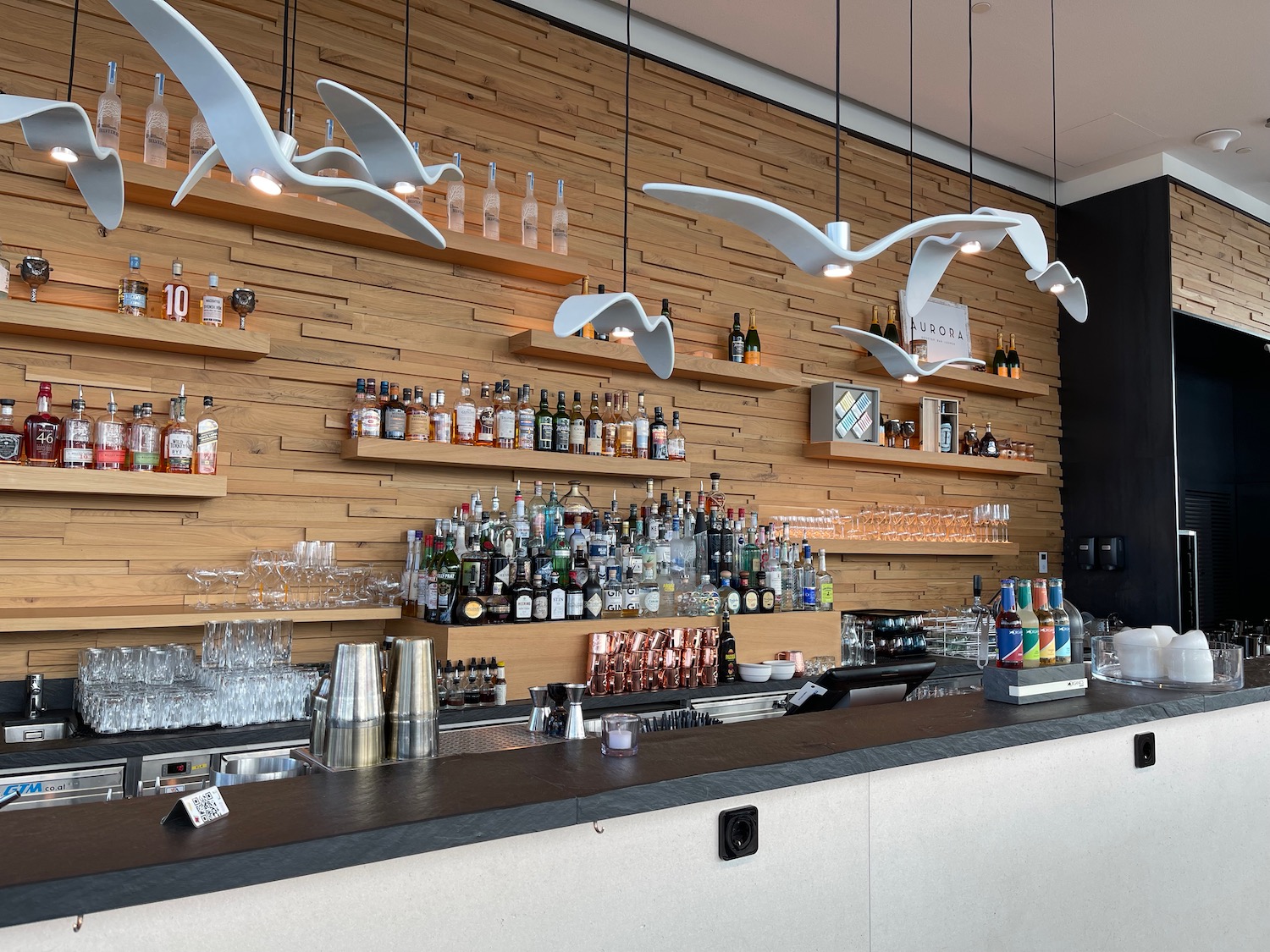 a bar with birds from the ceiling