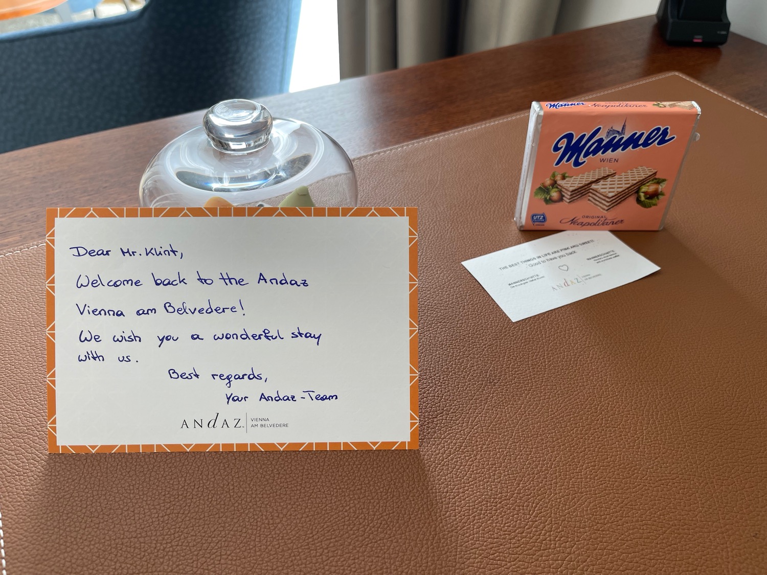 a note and a box on a table