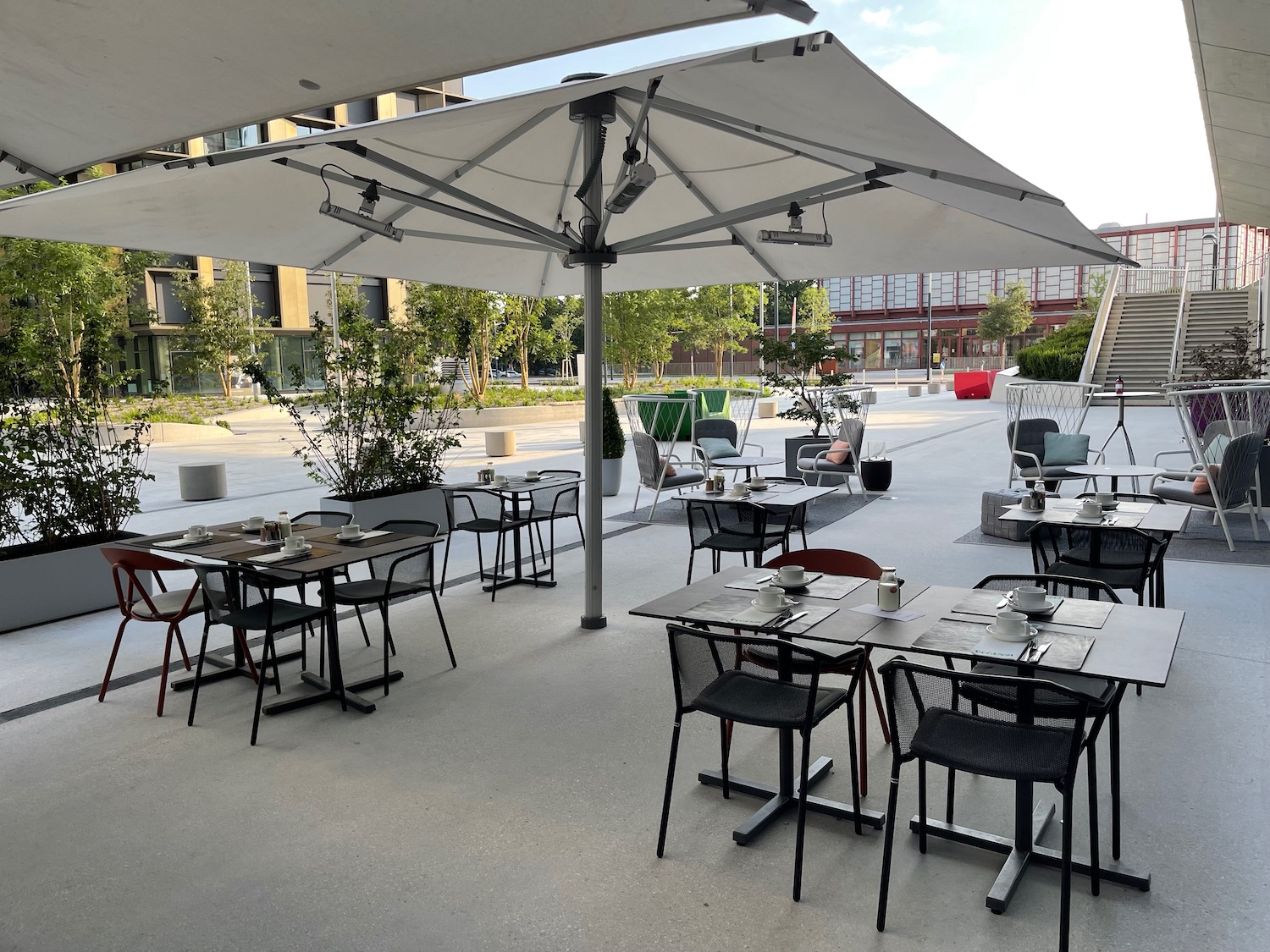 a patio with tables and chairs