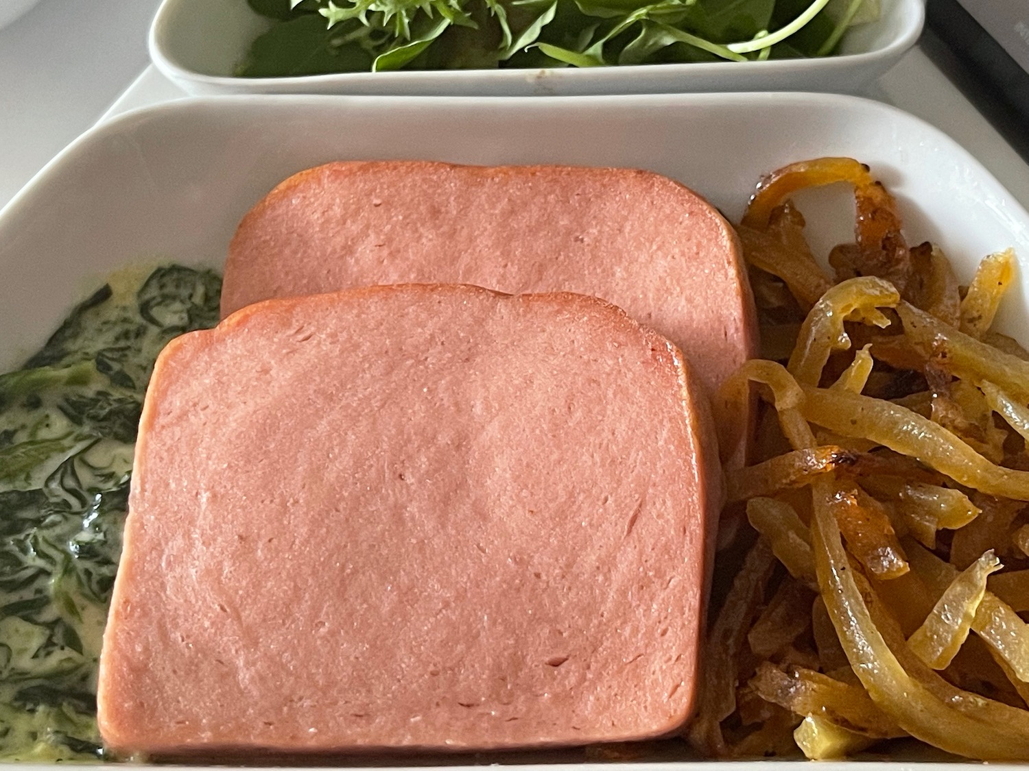 a plate of food with meat and vegetables