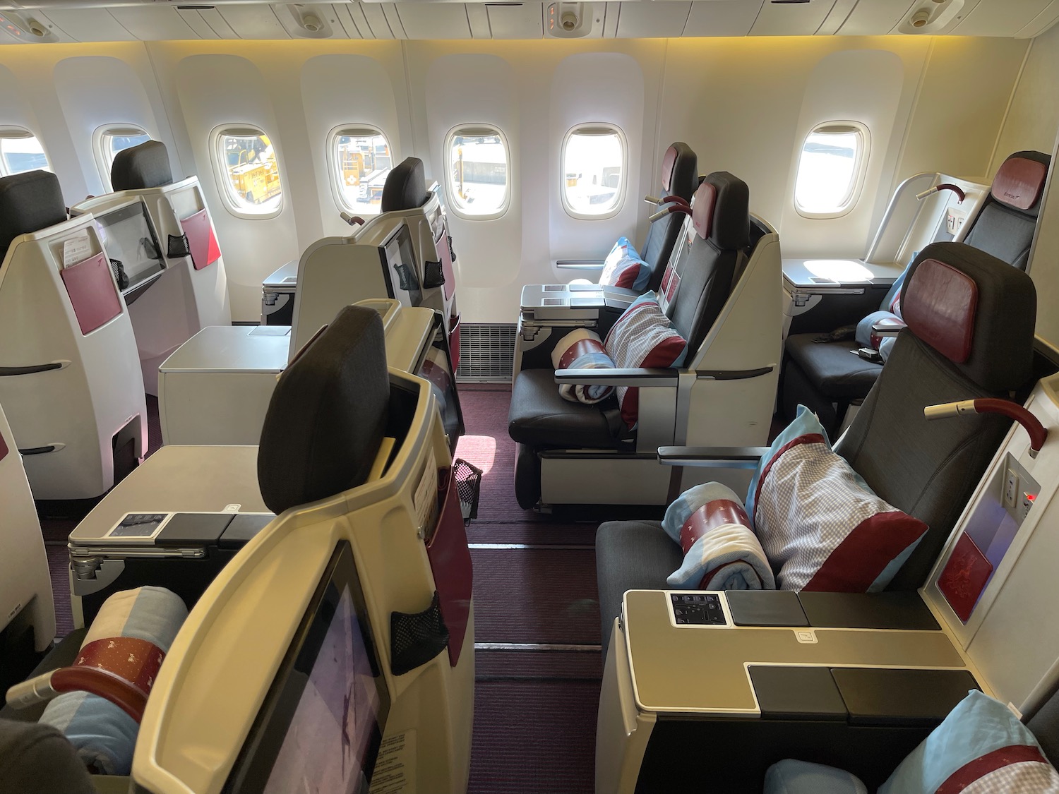 the inside of an airplane with seats and windows