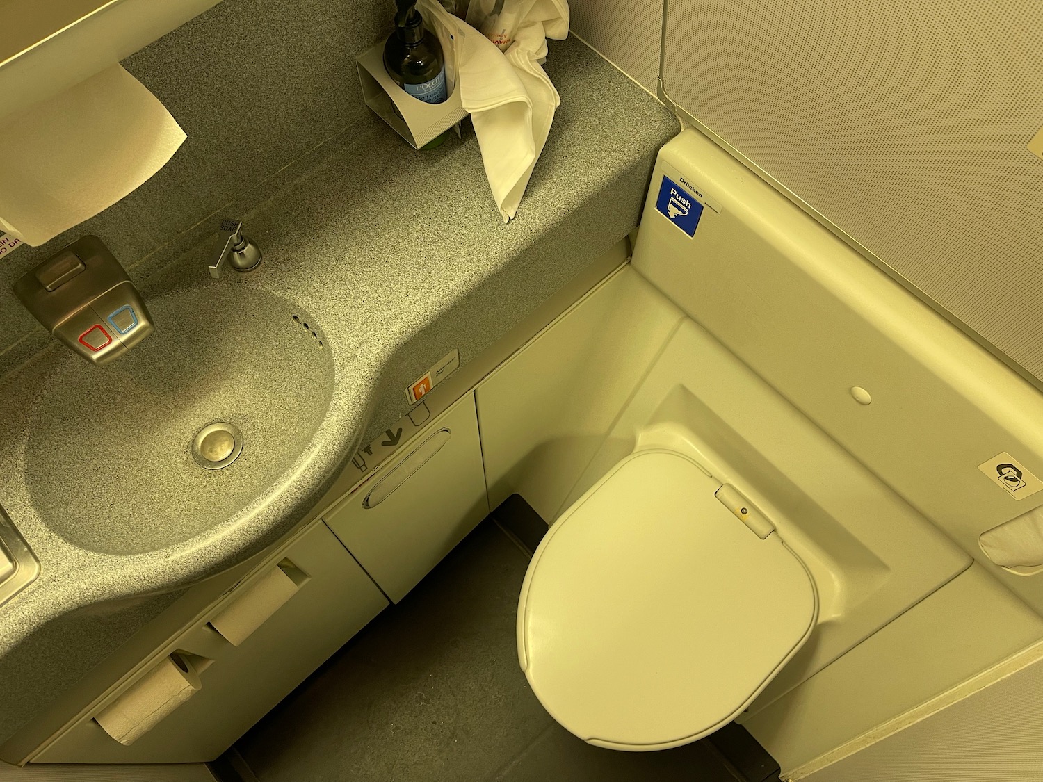 a toilet and sink in a bathroom