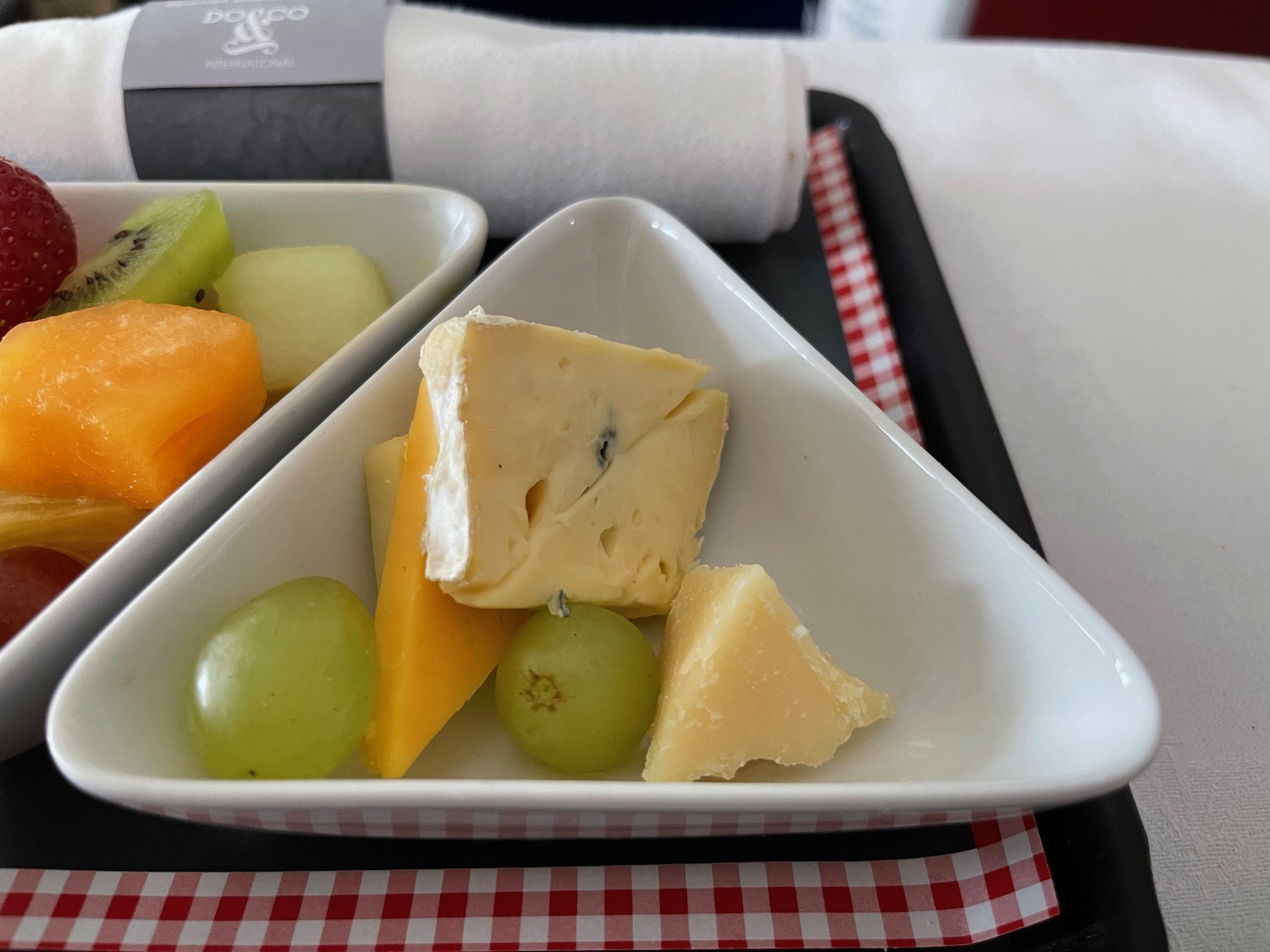 a plate of fruit and cheese