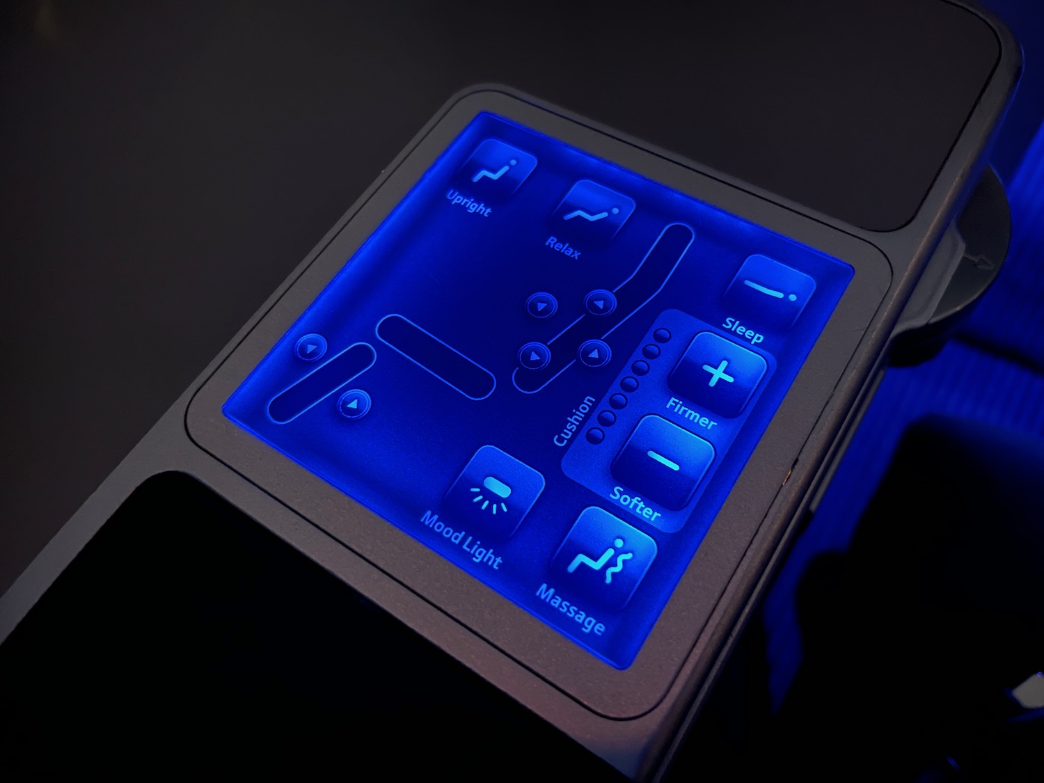 a blue lit device with buttons and text