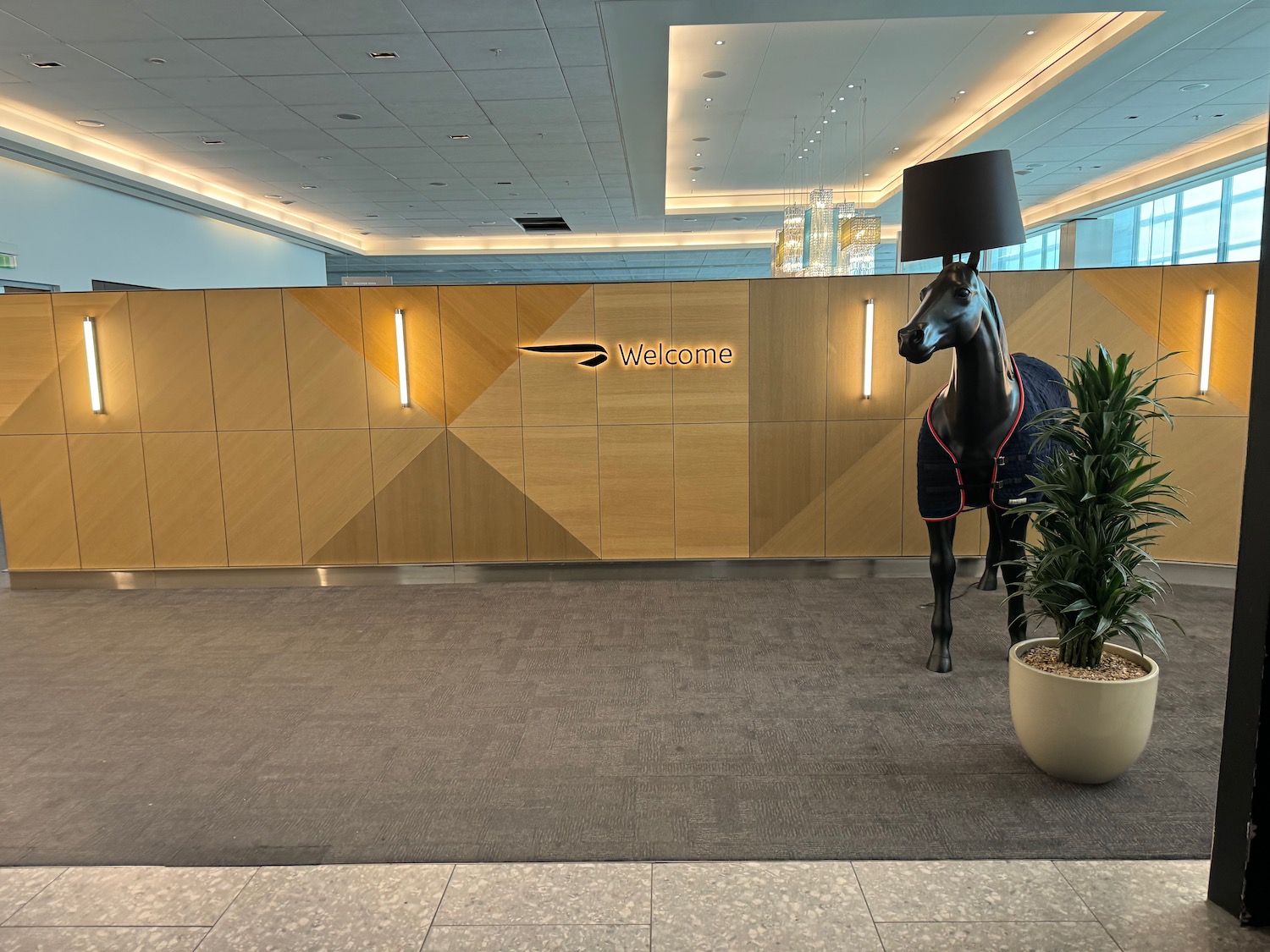 a horse statue with a lamp on its head