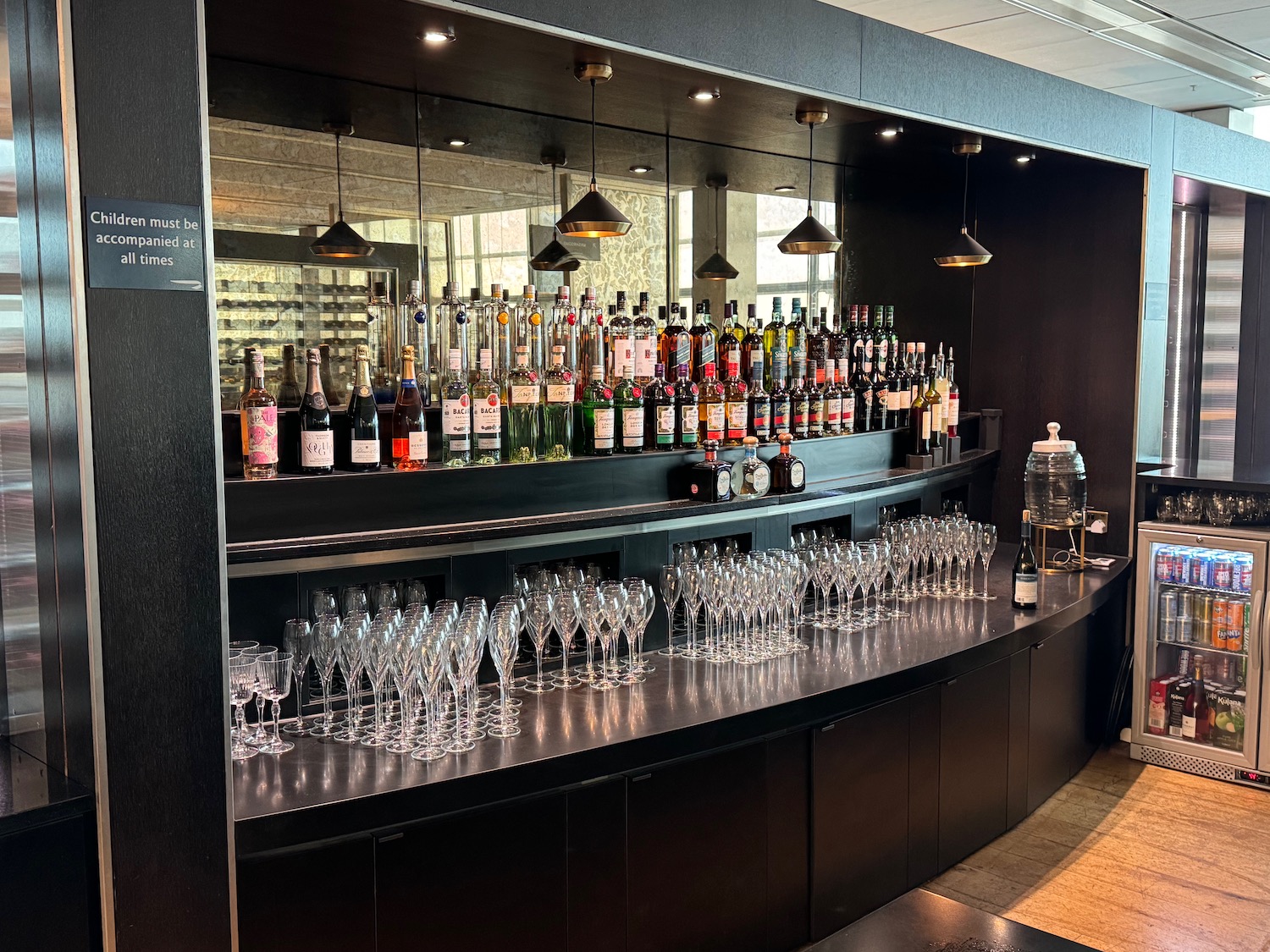 a bar with bottles and glasses