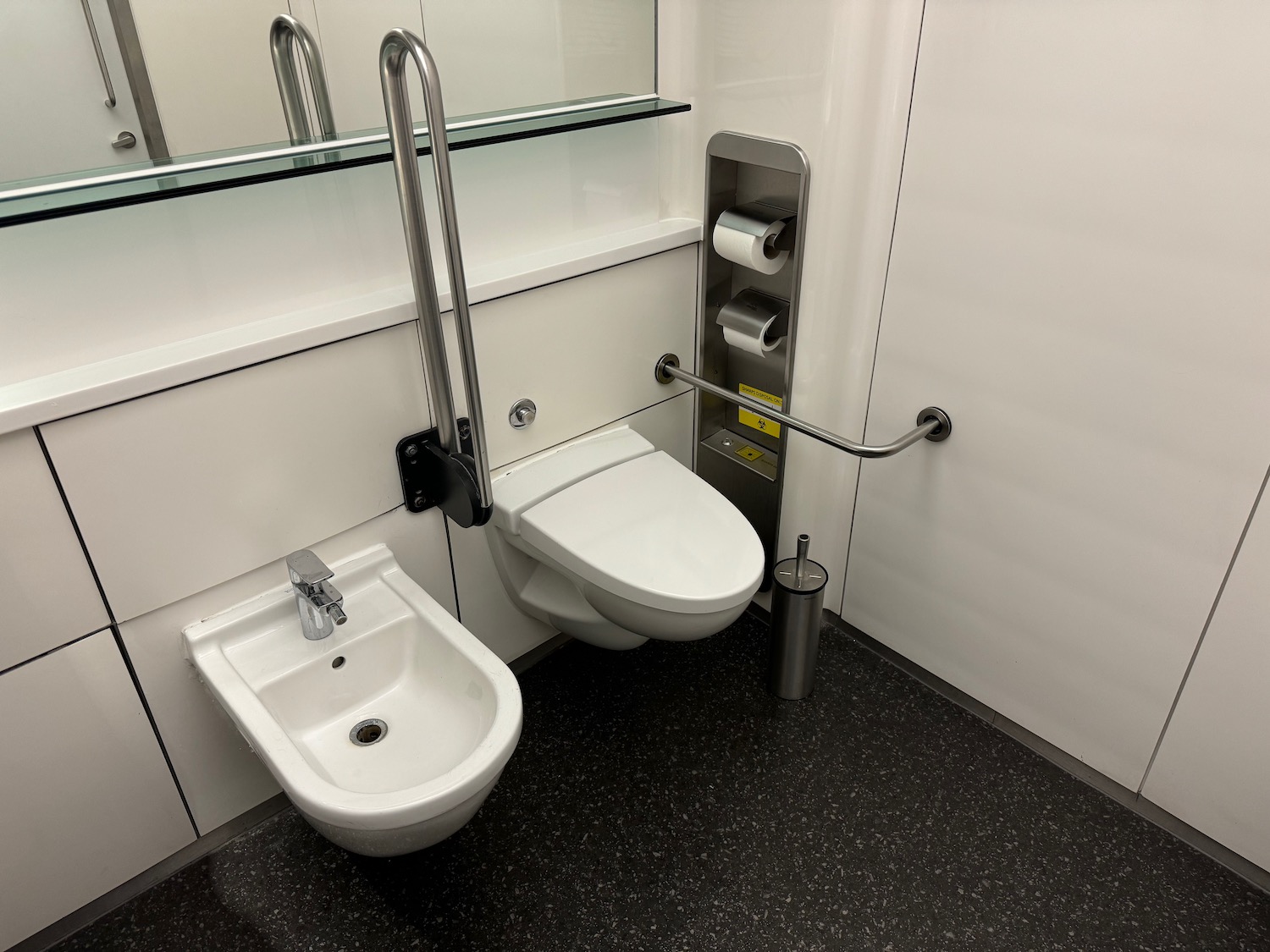 a toilet and bidet in a bathroom