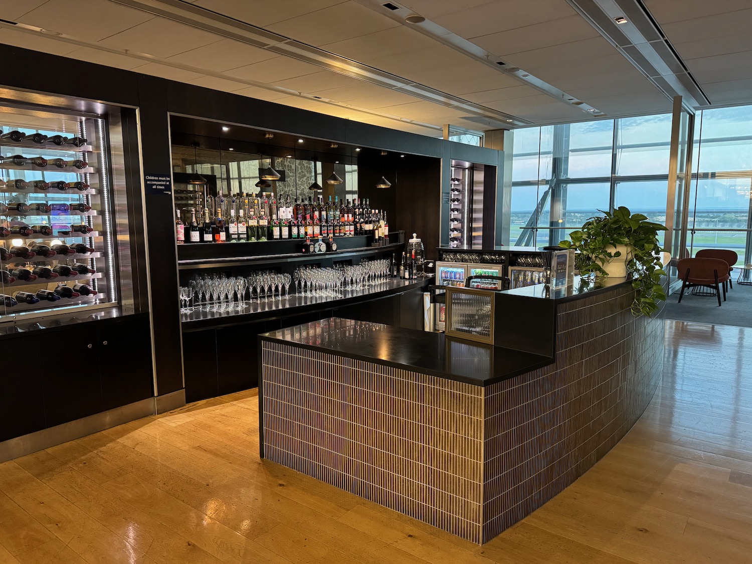 a bar with bottles of alcohol on the counter