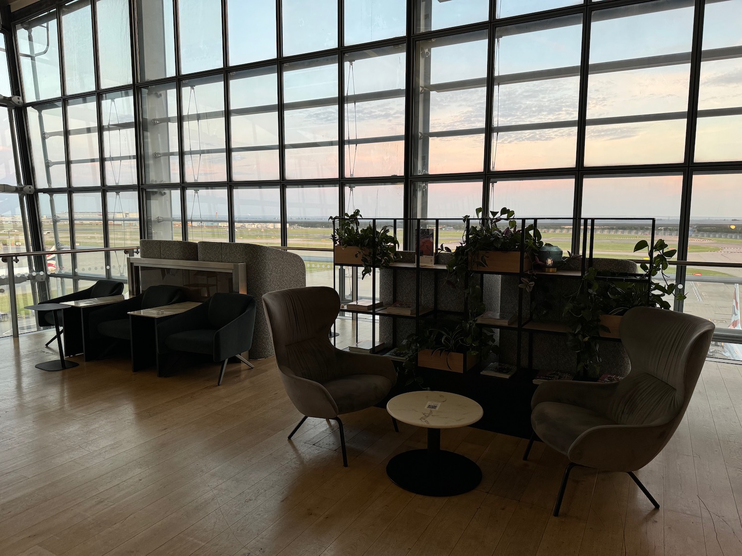 a room with chairs and tables and windows