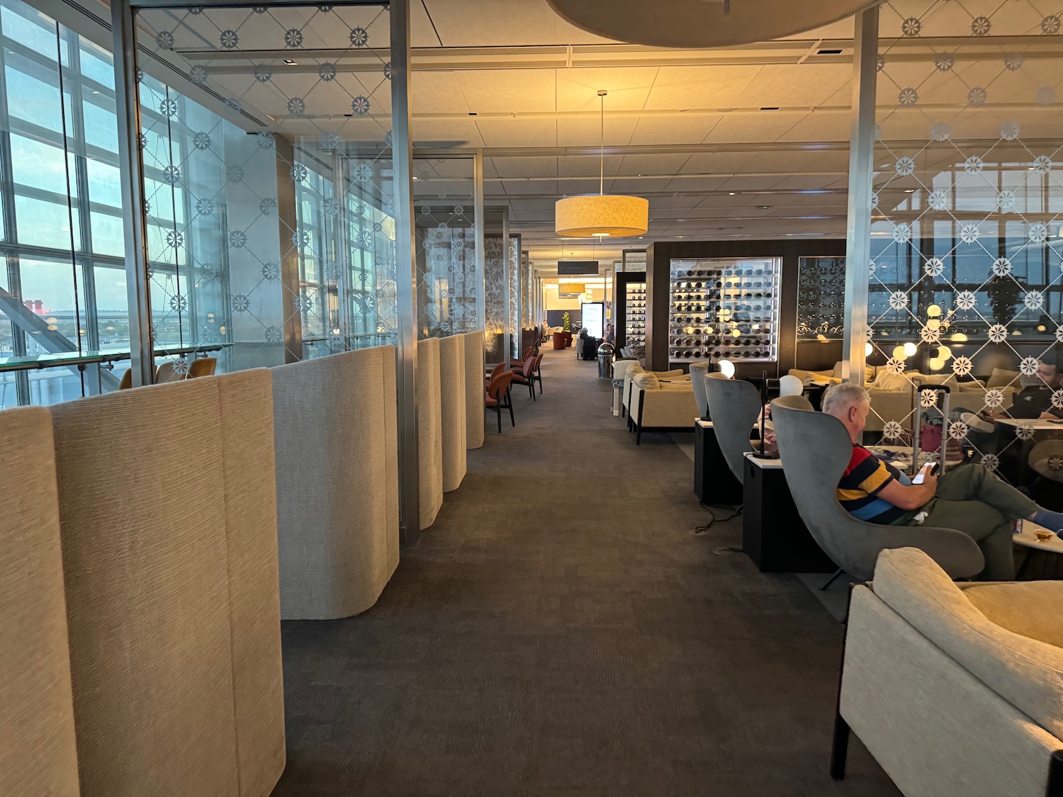 a room with a couple of people sitting at tables