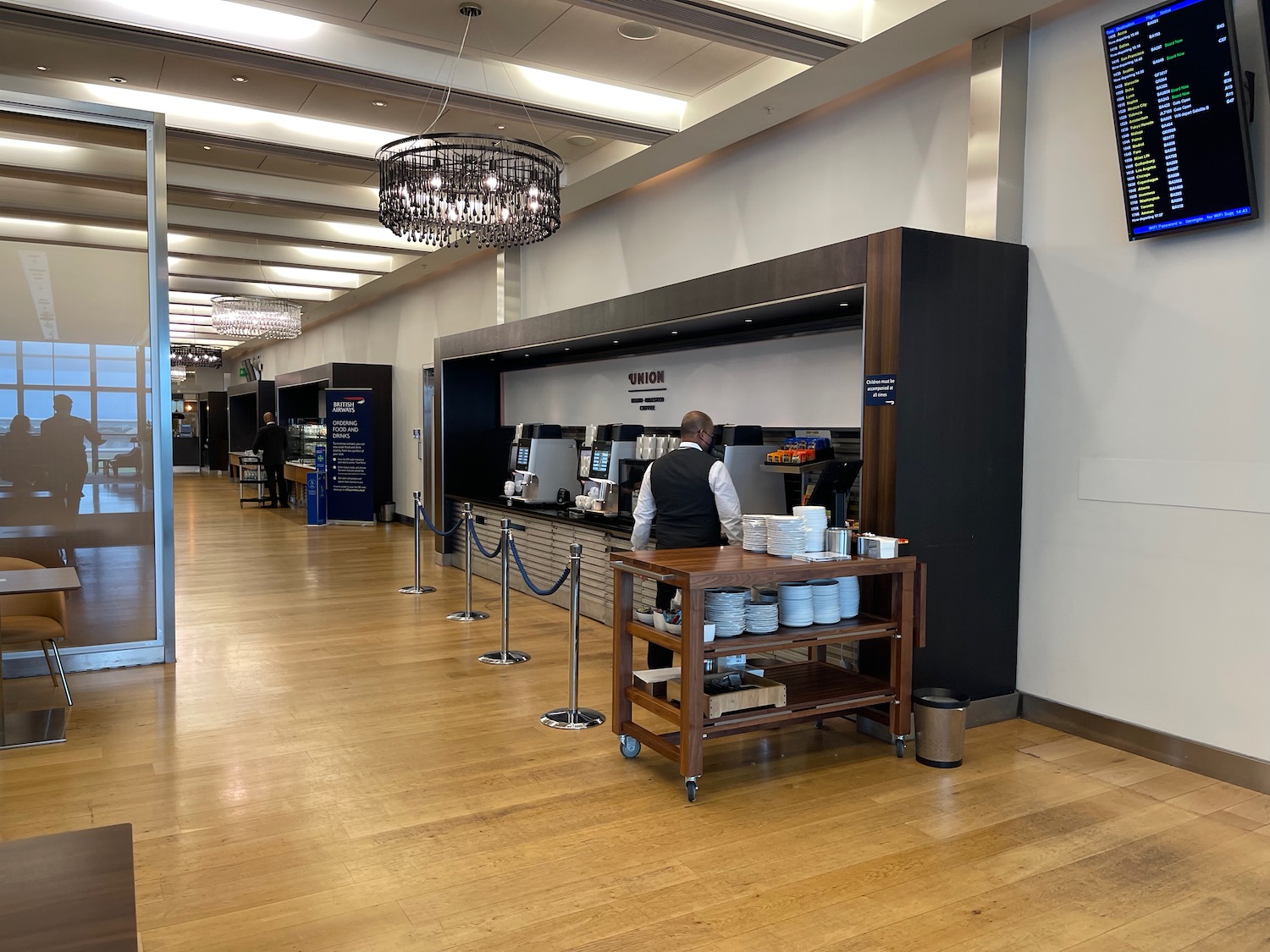 a man standing behind a counter in a building